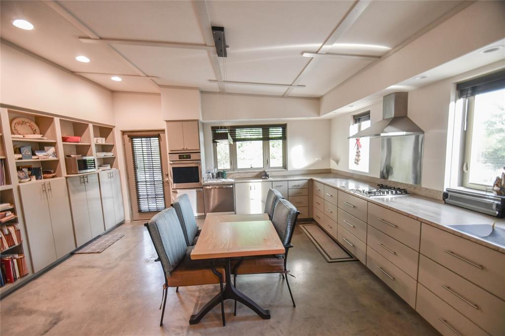 3257 Finis Road Graham, TX 76450 - Photo 38 of 40 a view of a dining room with furniture window and wooden floor