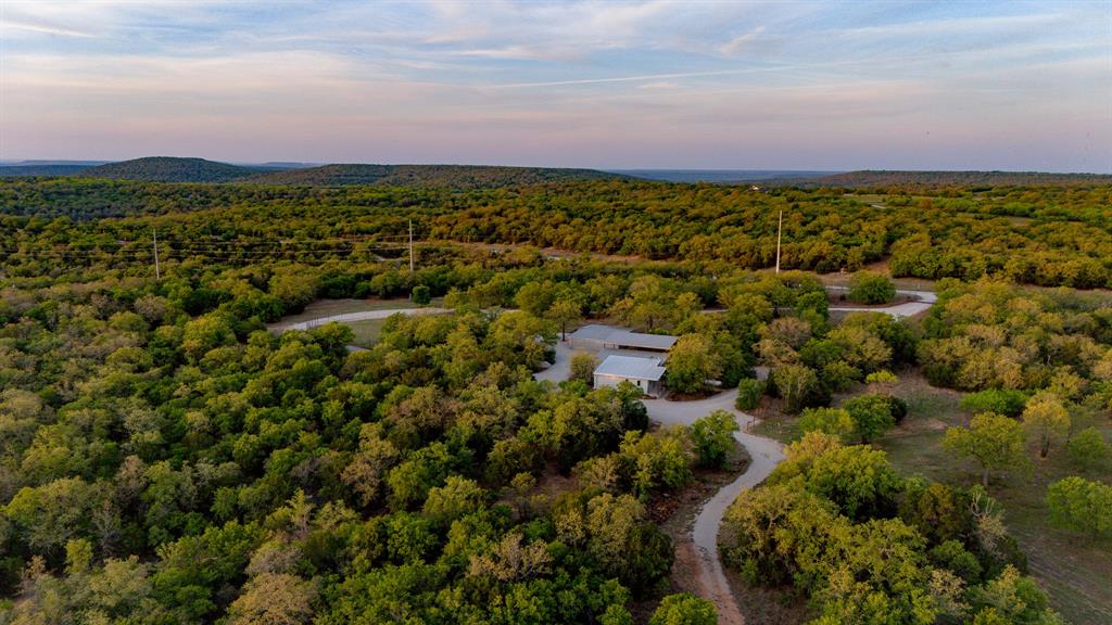 3257 Finis Road Graham, TX 76450 - Photo 5 of 40 an aerial view of residential houses with outdoor space and trees
