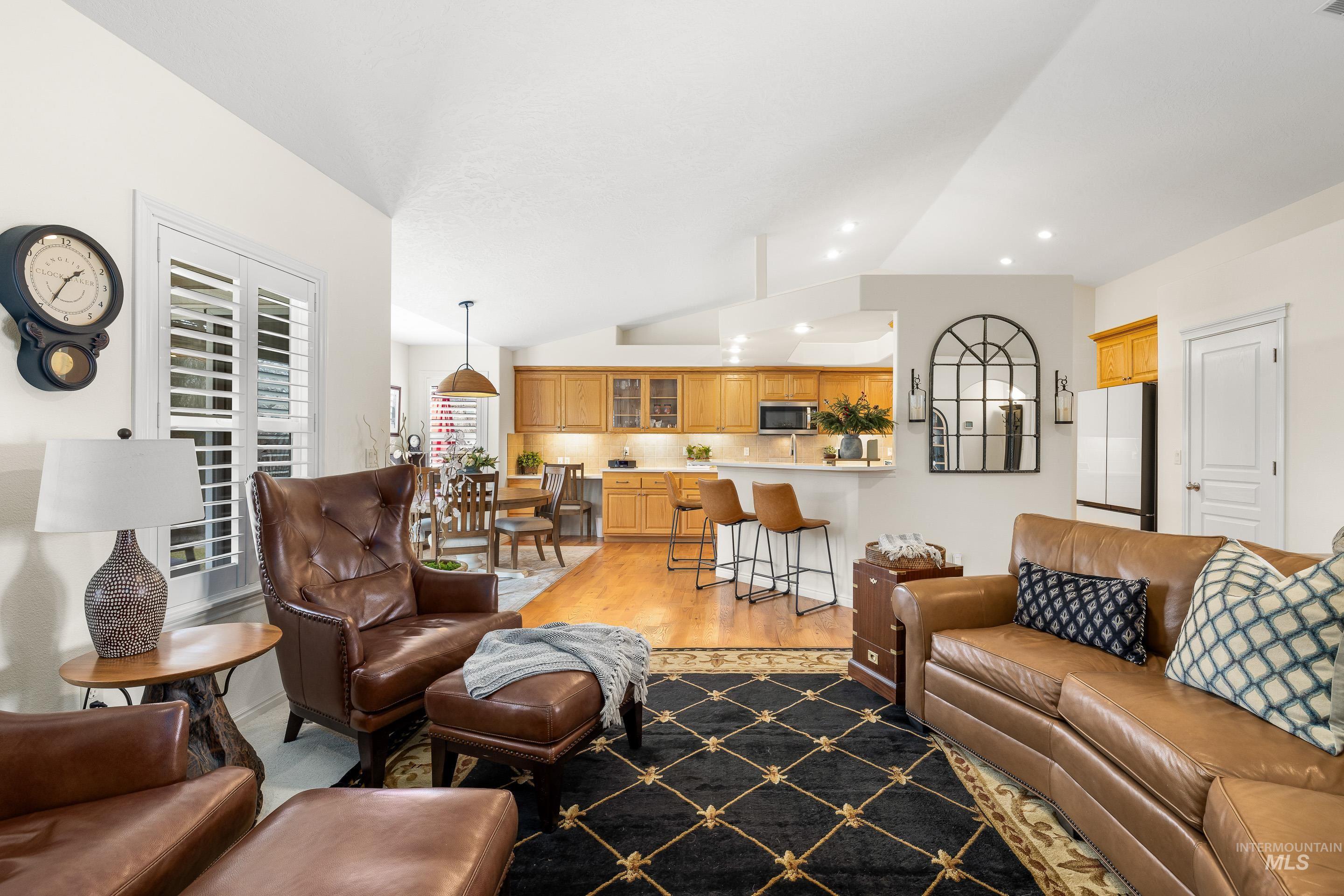 3631 North Alexis Way Meridian, ID 83646 - Photo 12 of 49 Living room with light wood-style floors, lofted ceiling, and recessed lighting
