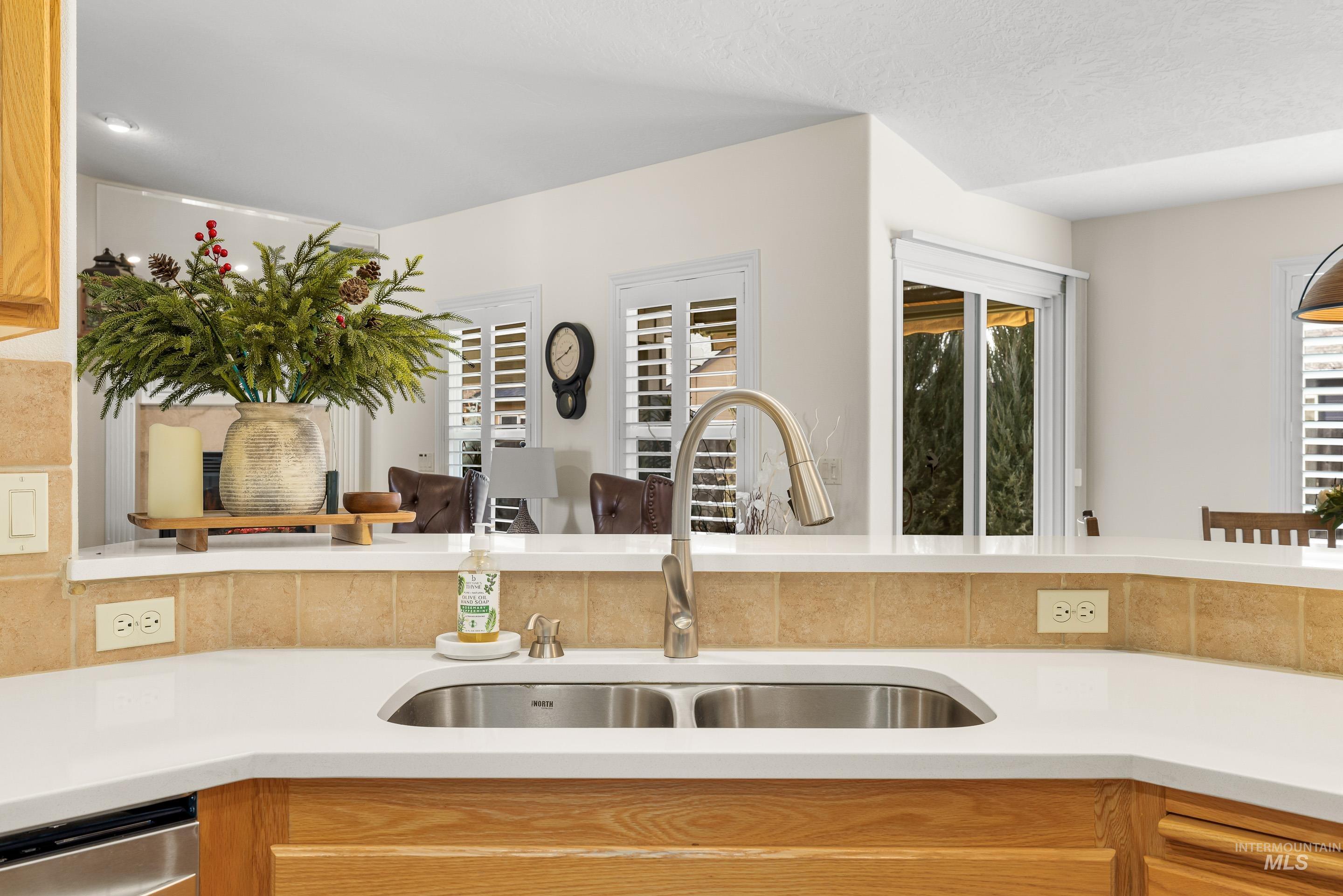 3631 North Alexis Way Meridian, ID 83646 - Photo 25 of 49 Kitchen with dishwasher and light stone countertops