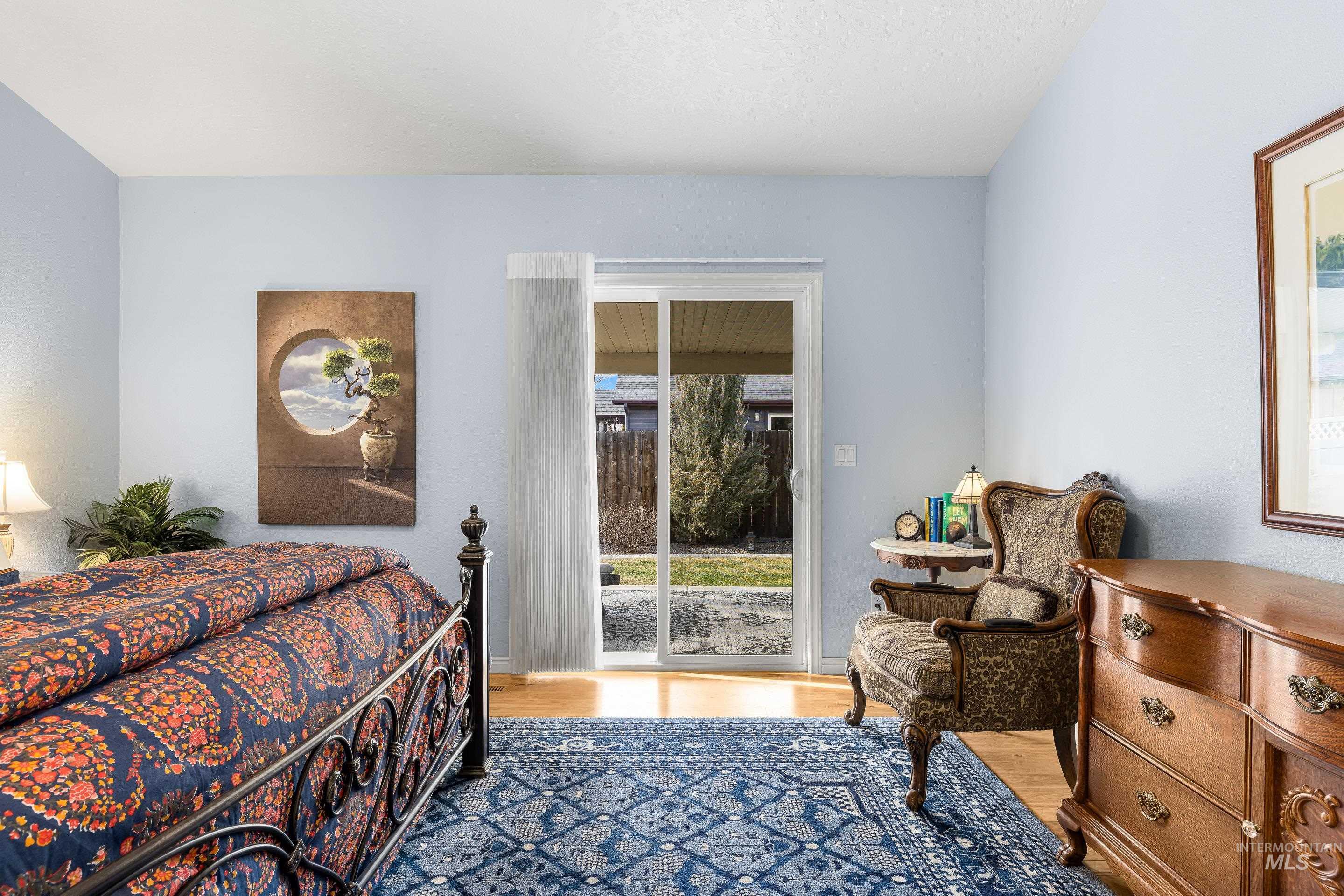 3631 North Alexis Way Meridian, ID 83646 - Photo 28 of 49 Bedroom with light wood-style flooring and access to outside