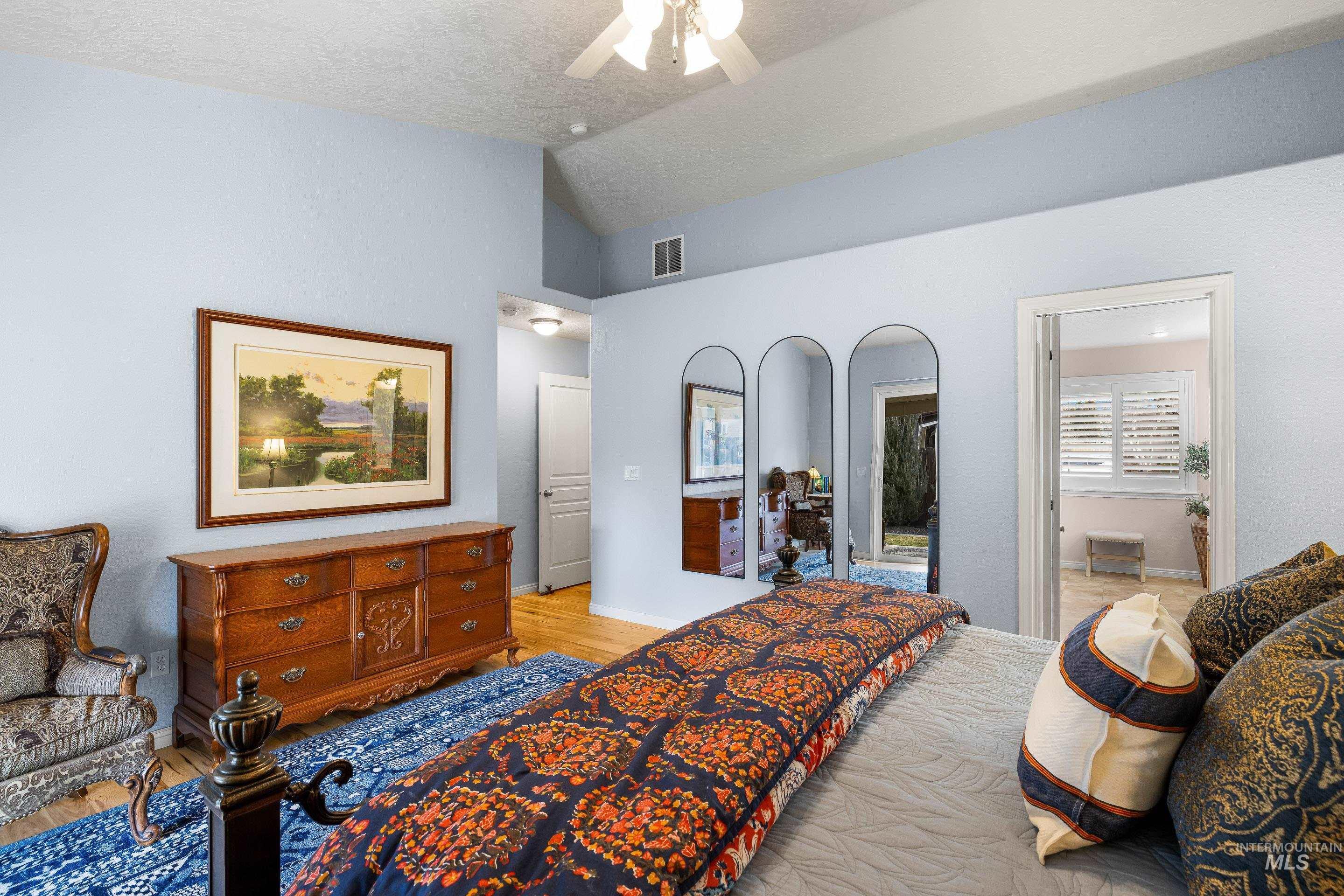 3631 North Alexis Way Meridian, ID 83646 - Photo 29 of 49 Bedroom with light wood-type flooring, lofted ceiling, and a ceiling fan