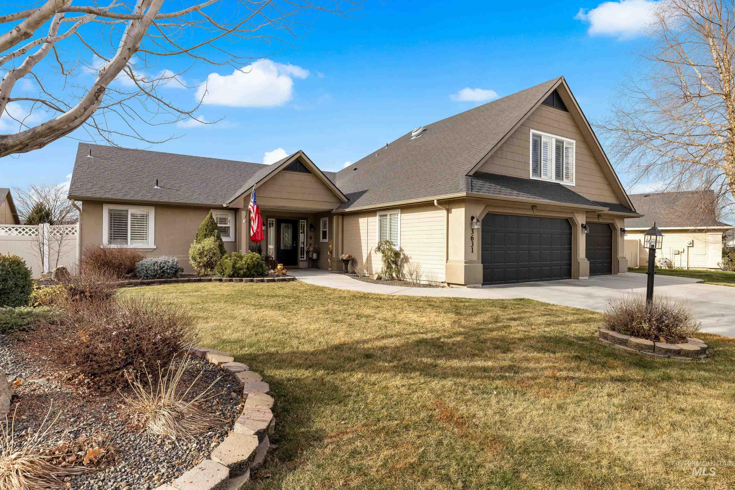 3631 North Alexis Way Meridian, ID 83646 - Photo 3 of 49 View of front of home featuring roof with shingles, driveway, and a garage