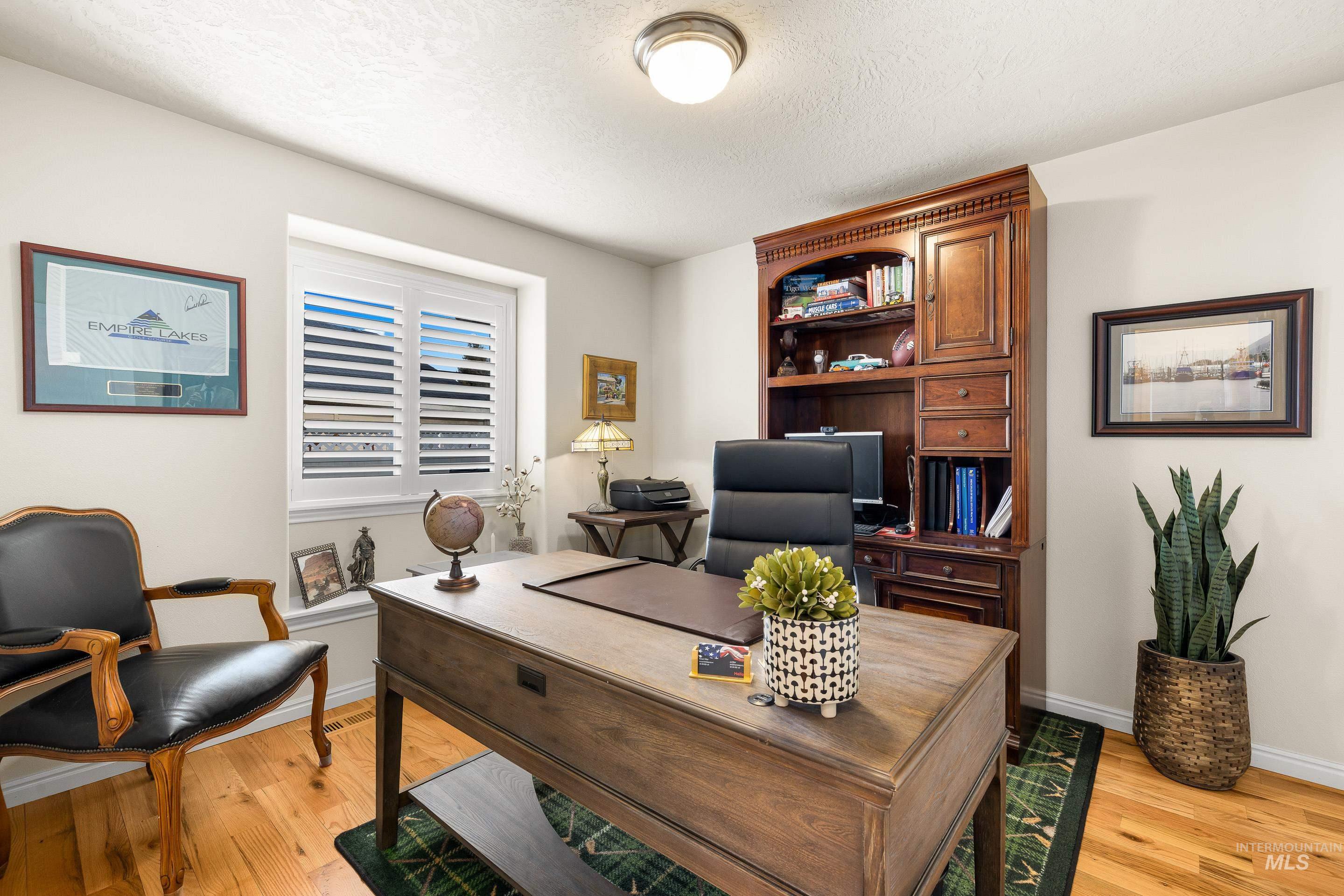 3631 North Alexis Way Meridian, ID 83646 - Photo 35 of 49 Office with light wood-style floors and a textured ceiling