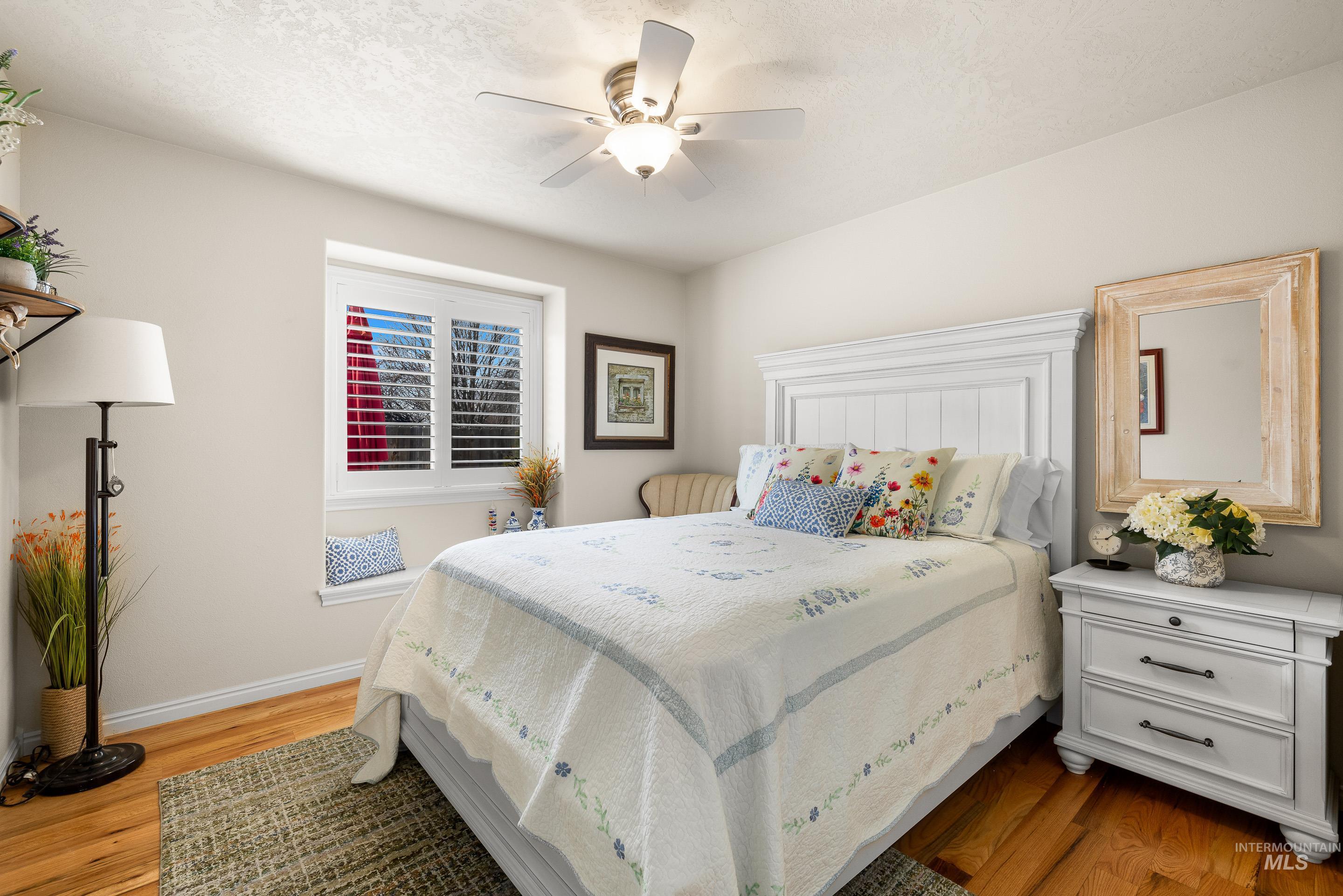 3631 North Alexis Way Meridian, ID 83646 - Photo 36 of 49 Bedroom with light wood-style floors and a ceiling fan