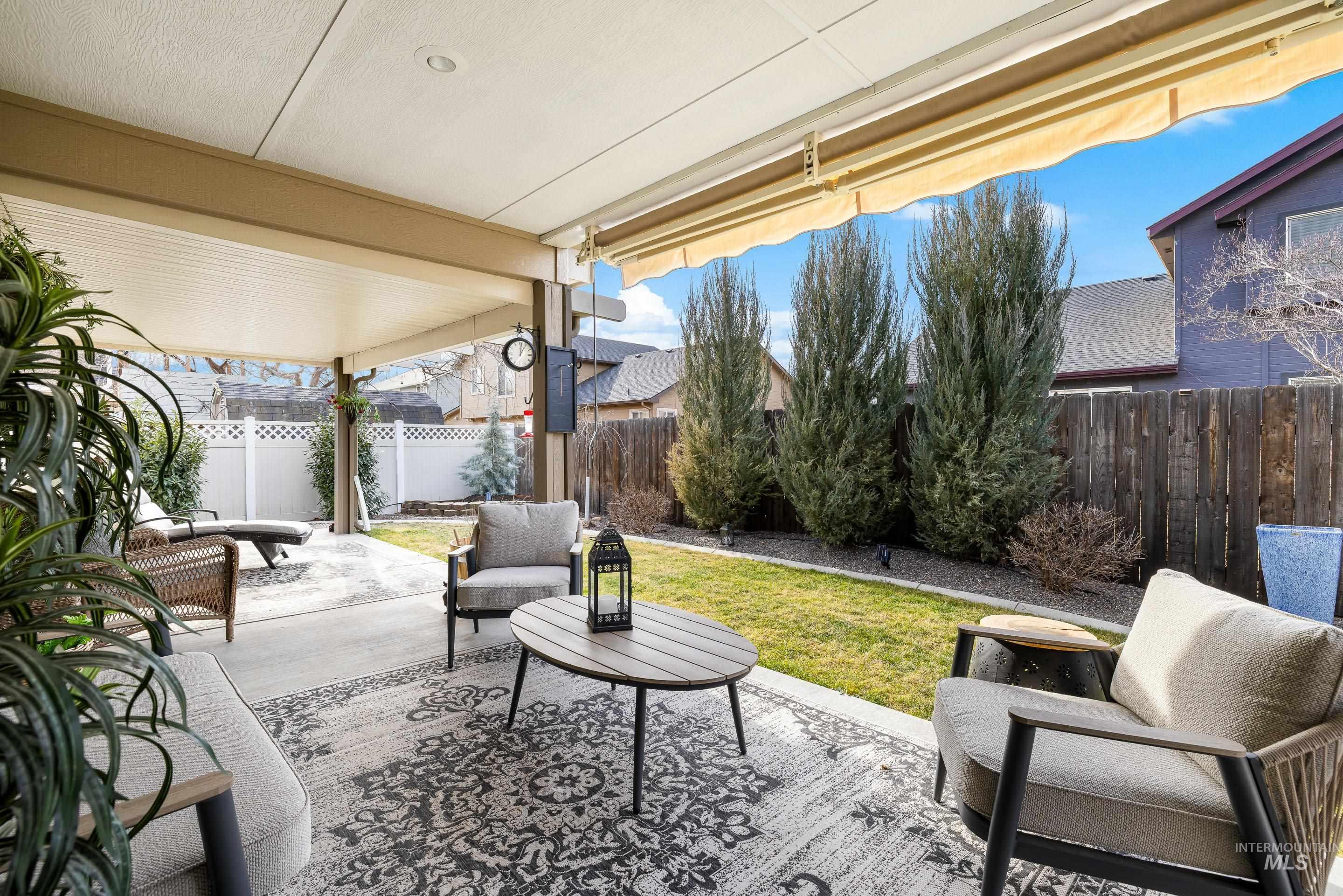 3631 North Alexis Way Meridian, ID 83646 - Photo 41 of 49 Fenced backyard featuring an outdoor hangout area and a patio
