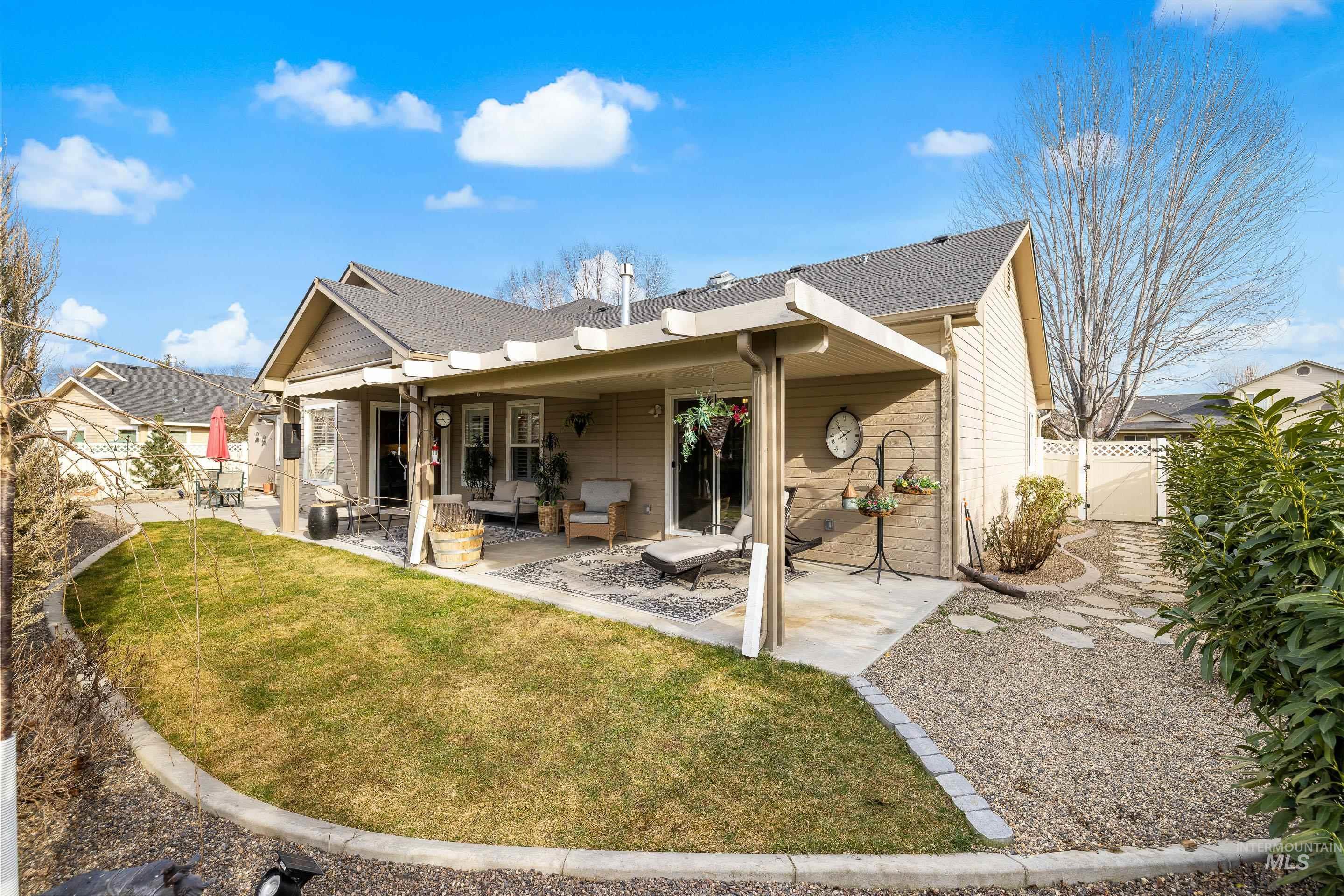 3631 North Alexis Way Meridian, ID 83646 - Photo 43 of 49 Rear view of property featuring outdoor lounge area, a fenced backyard, a patio area, roof with shingles, and a gate