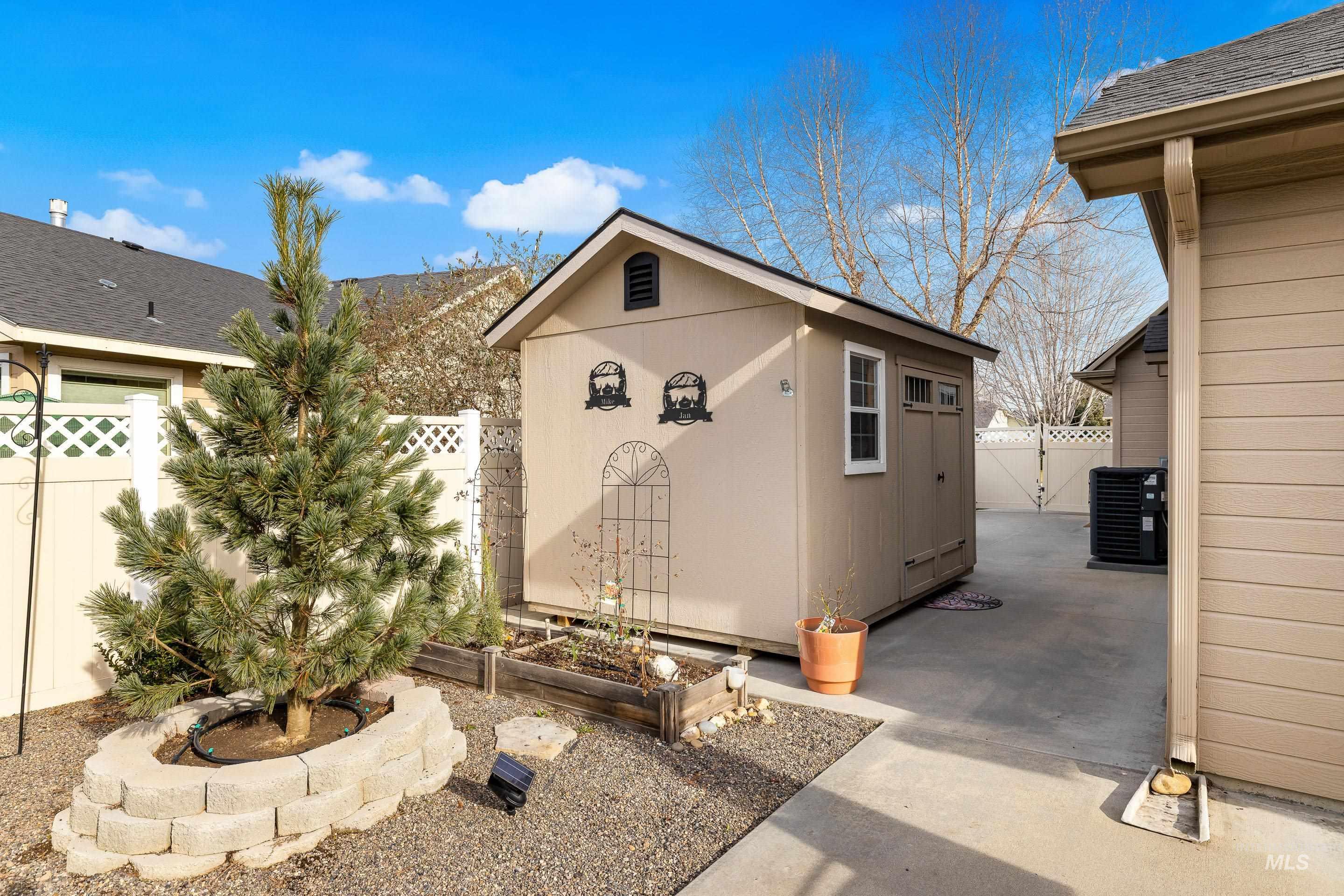 3631 North Alexis Way Meridian, ID 83646 - Photo 45 of 49 View of outdoor structure with a fenced backyard and a vegetable garden