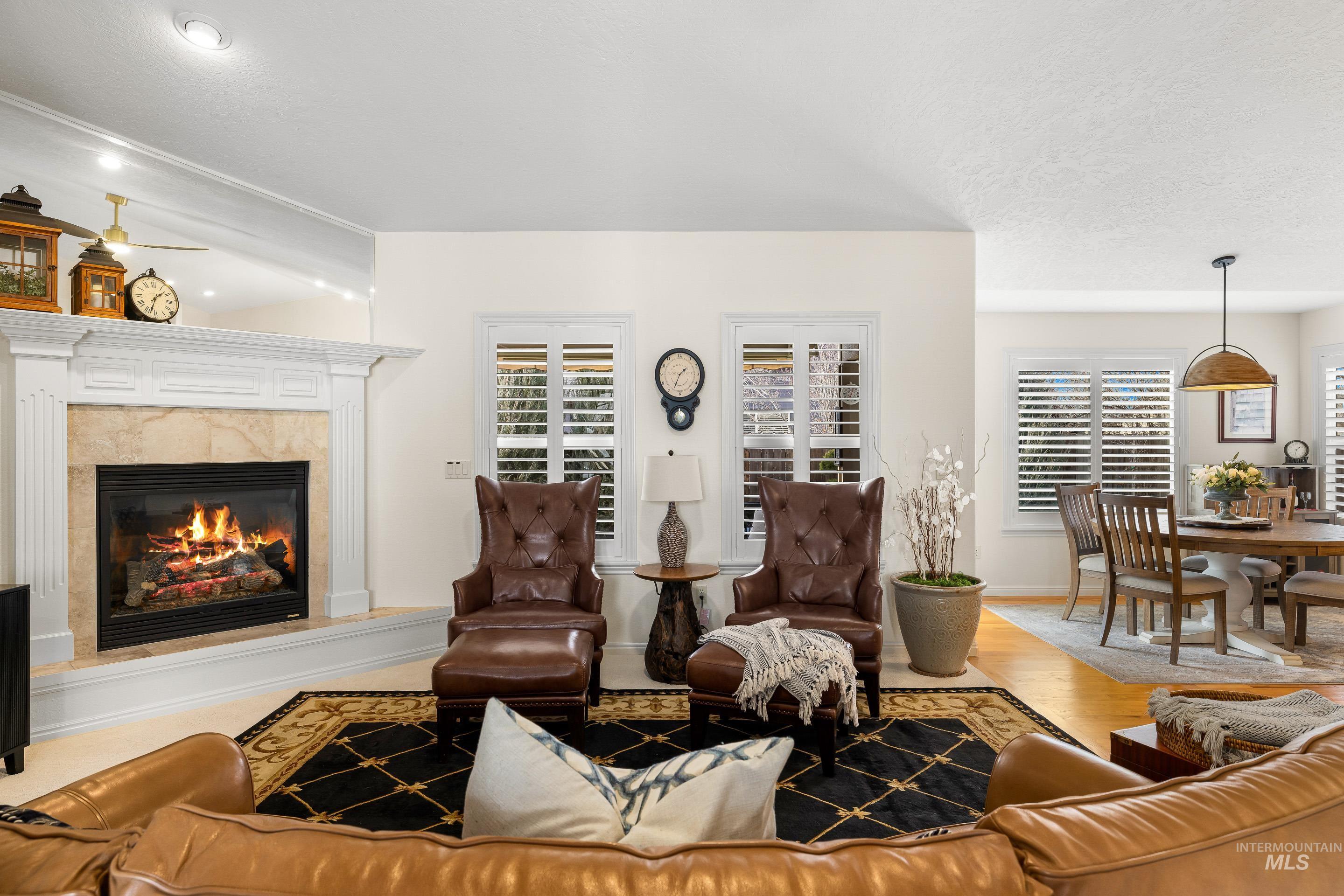 3631 North Alexis Way Meridian, ID 83646 - Photo 6 of 49 Living room featuring wood finished floors, a high end fireplace, and healthy amount of natural light