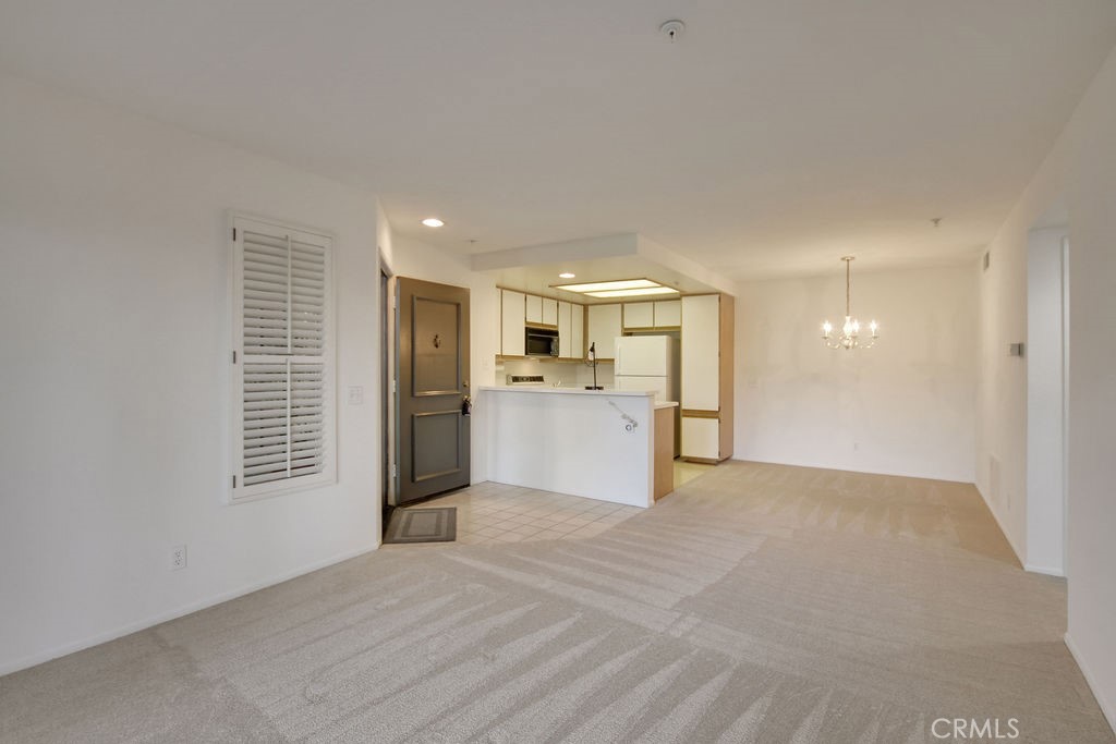 2800 Keller Drive, Unit 282 Tustin, CA 92782 - Photo 8 of 19 a view of a kitchen with a sink and a refrigerator