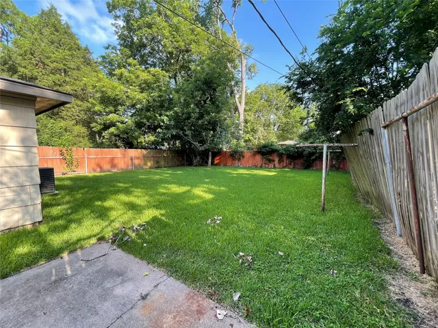 a view of a backyard with a small cabin