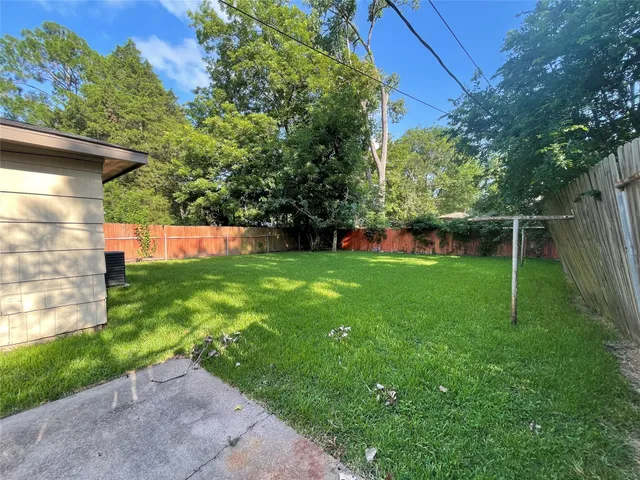 a view of green field with sitting area