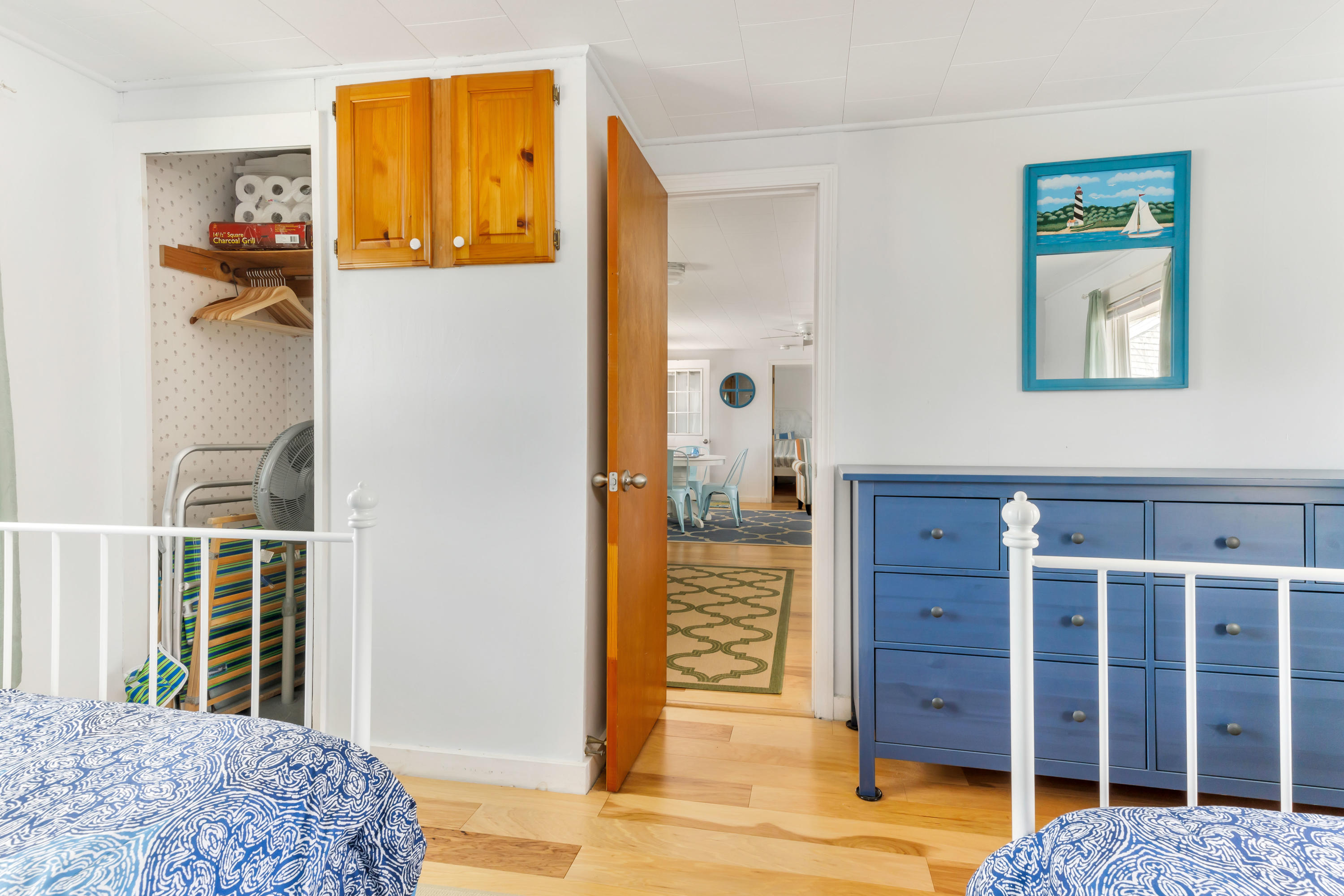148 Shore Road, Unit 2 Truro, MA 02666 - Photo 11 of 16 a bedroom with a bed and wooden floor