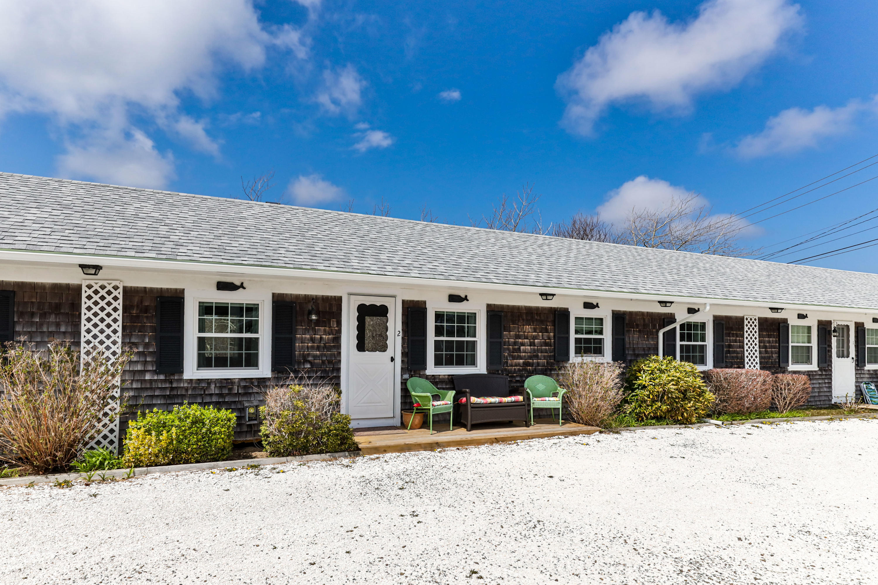 148 Shore Road, Unit 2 Truro, MA 02666 - Photo 16 of 16 a view of a house with a patio