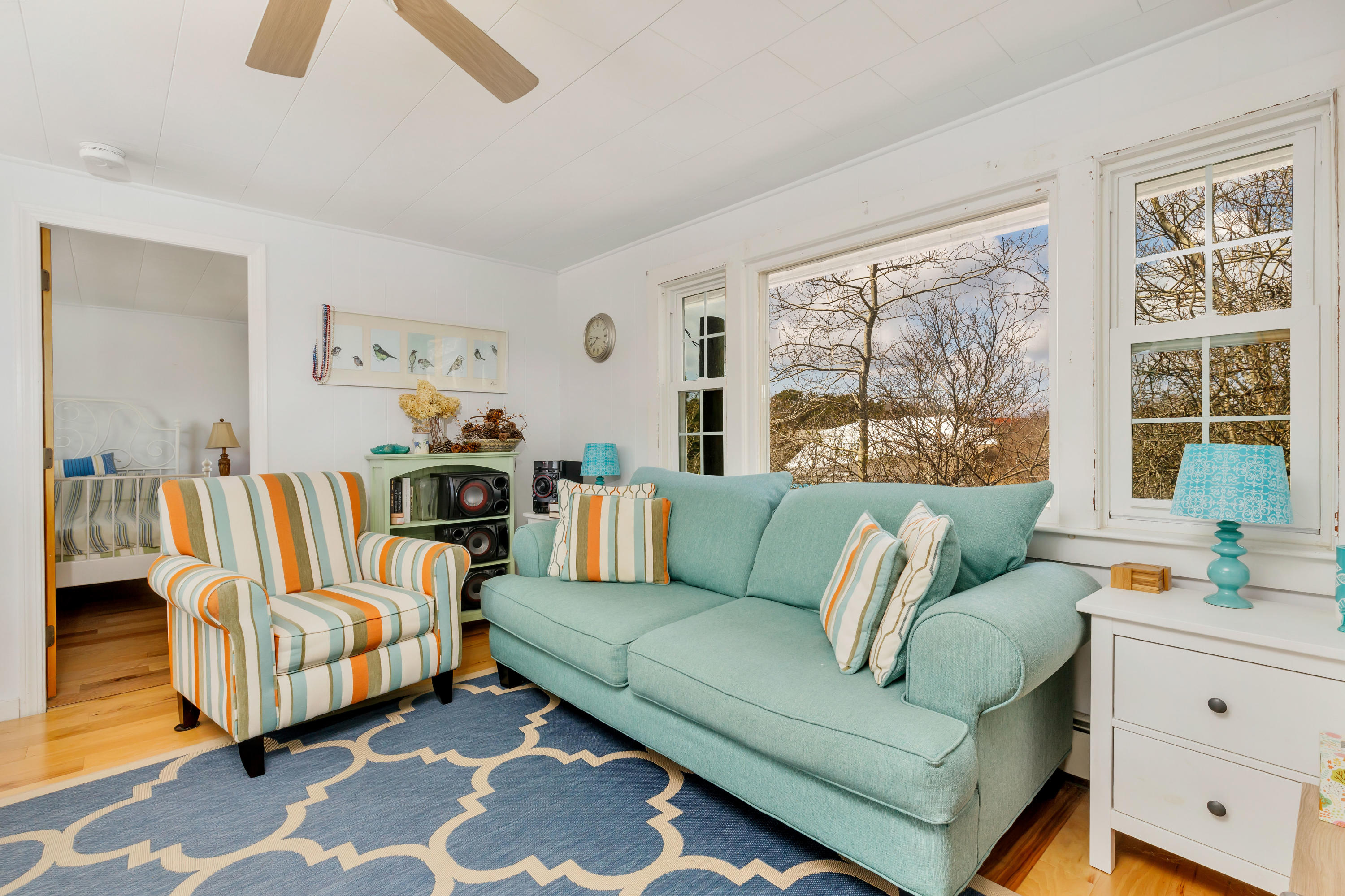 148 Shore Road, Unit 2 Truro, MA 02666 - Photo 5 of 16 a living room with furniture and a large window