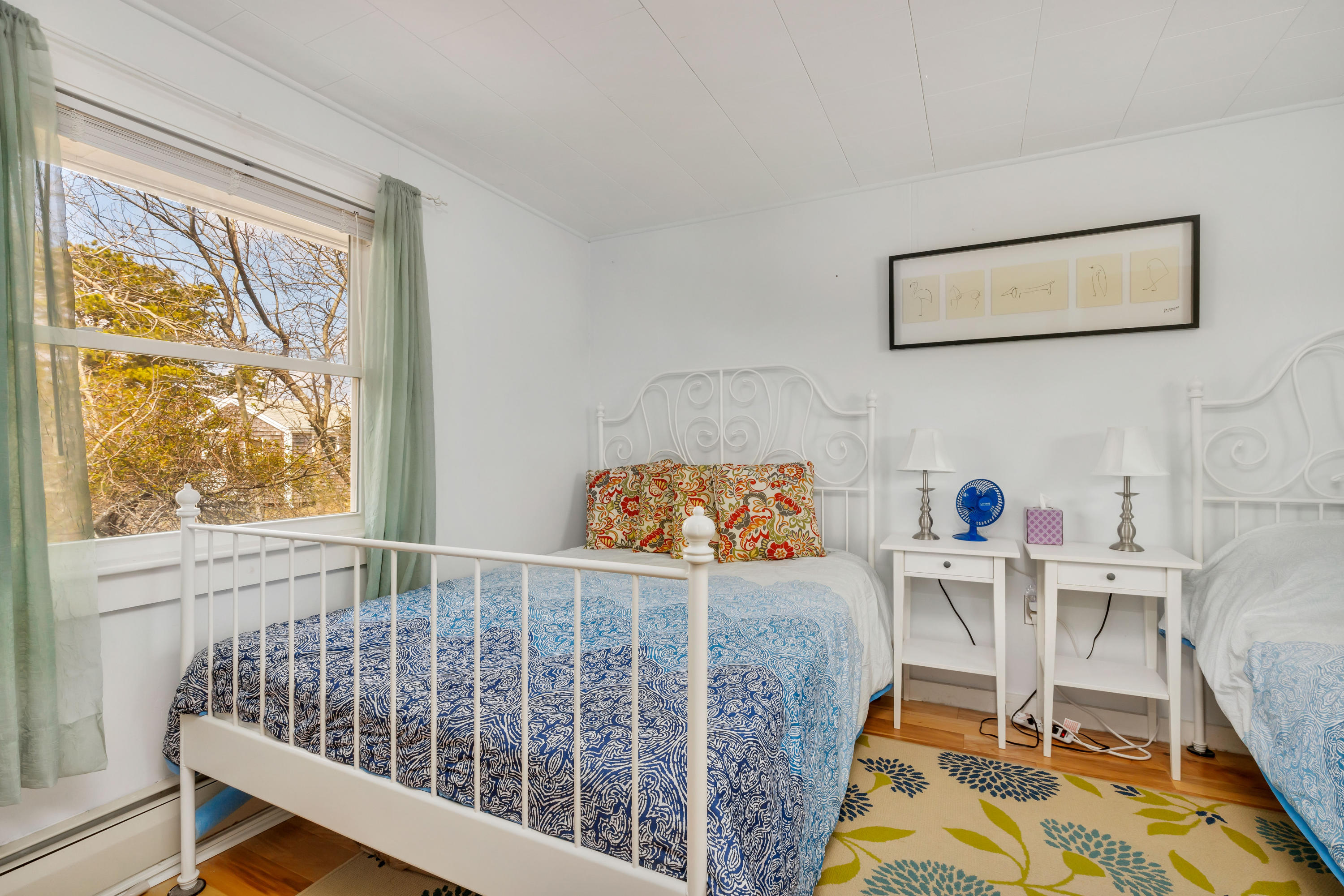 148 Shore Road, Unit 2 Truro, MA 02666 - Photo 9 of 16 a bed room with a bed and a window