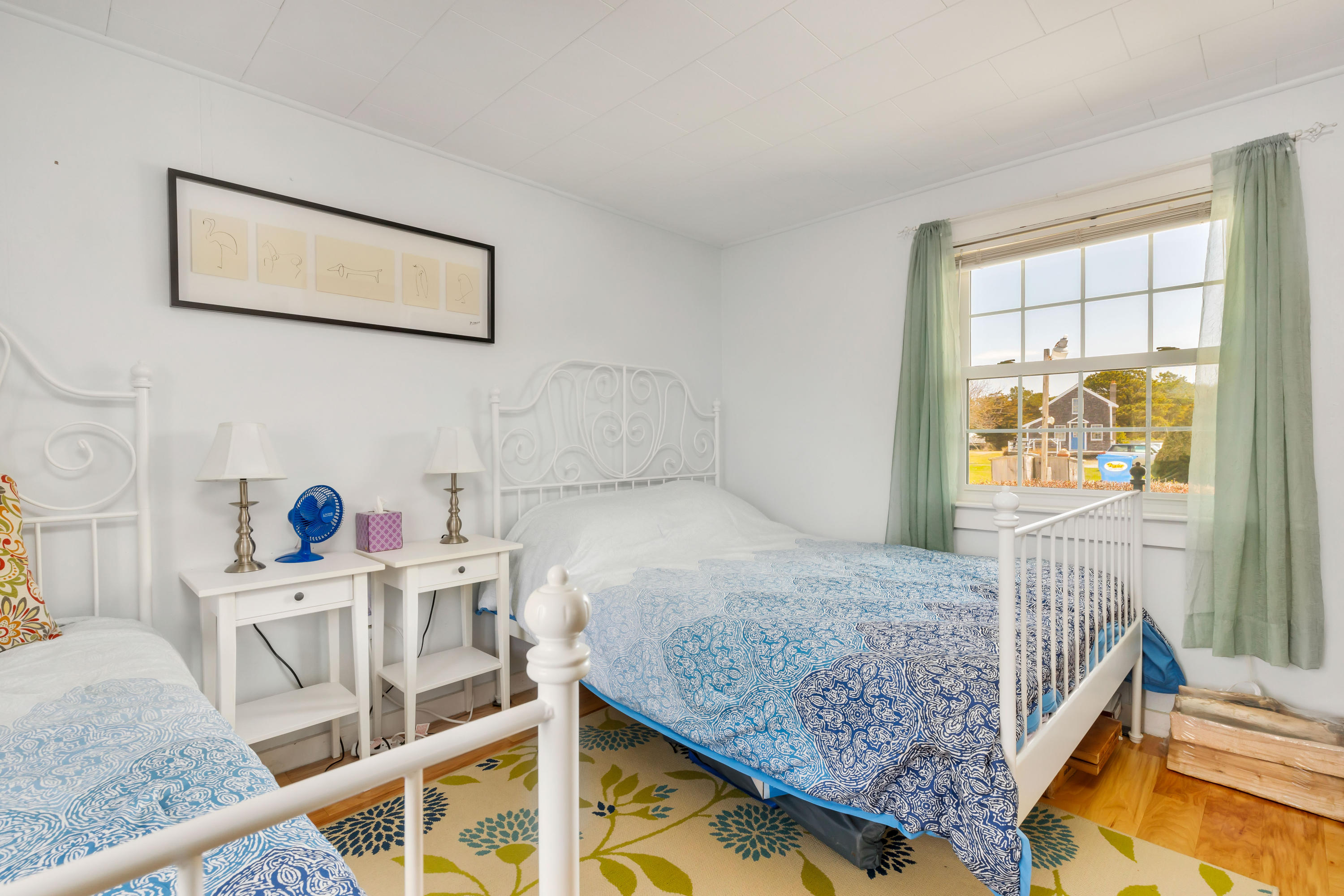 148 Shore Road, Unit 2 Truro, MA 02666 - Photo 10 of 16 a bedroom with a bed and next to a window