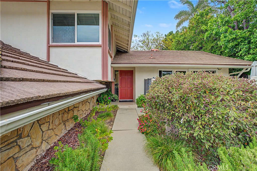 22671 Town Crier Road Calabasas, CA 91302 - Photo 4 of 35 a view of house with garden