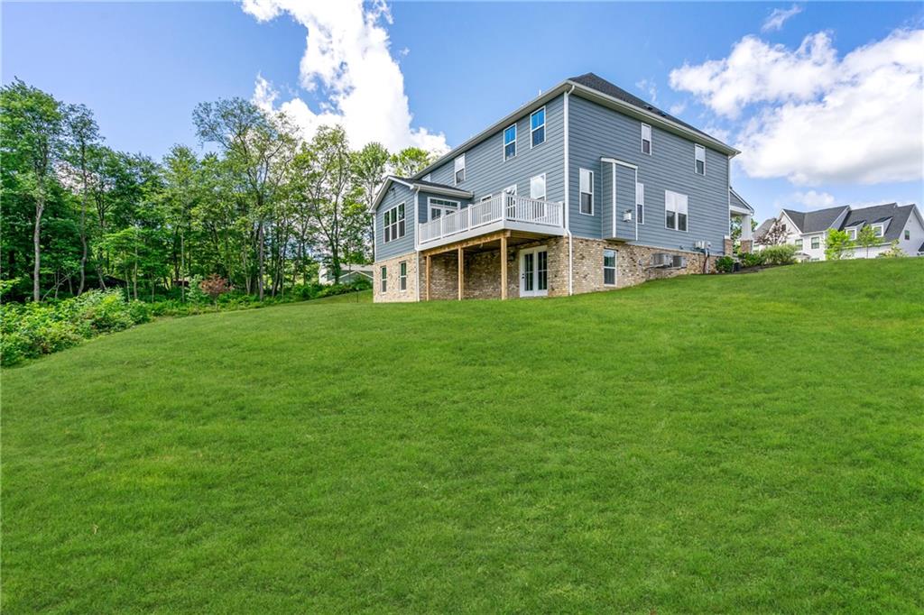 103 Abigail Drive Mars, PA 16046 - Photo 7 of 14 a front view of a house with garden
