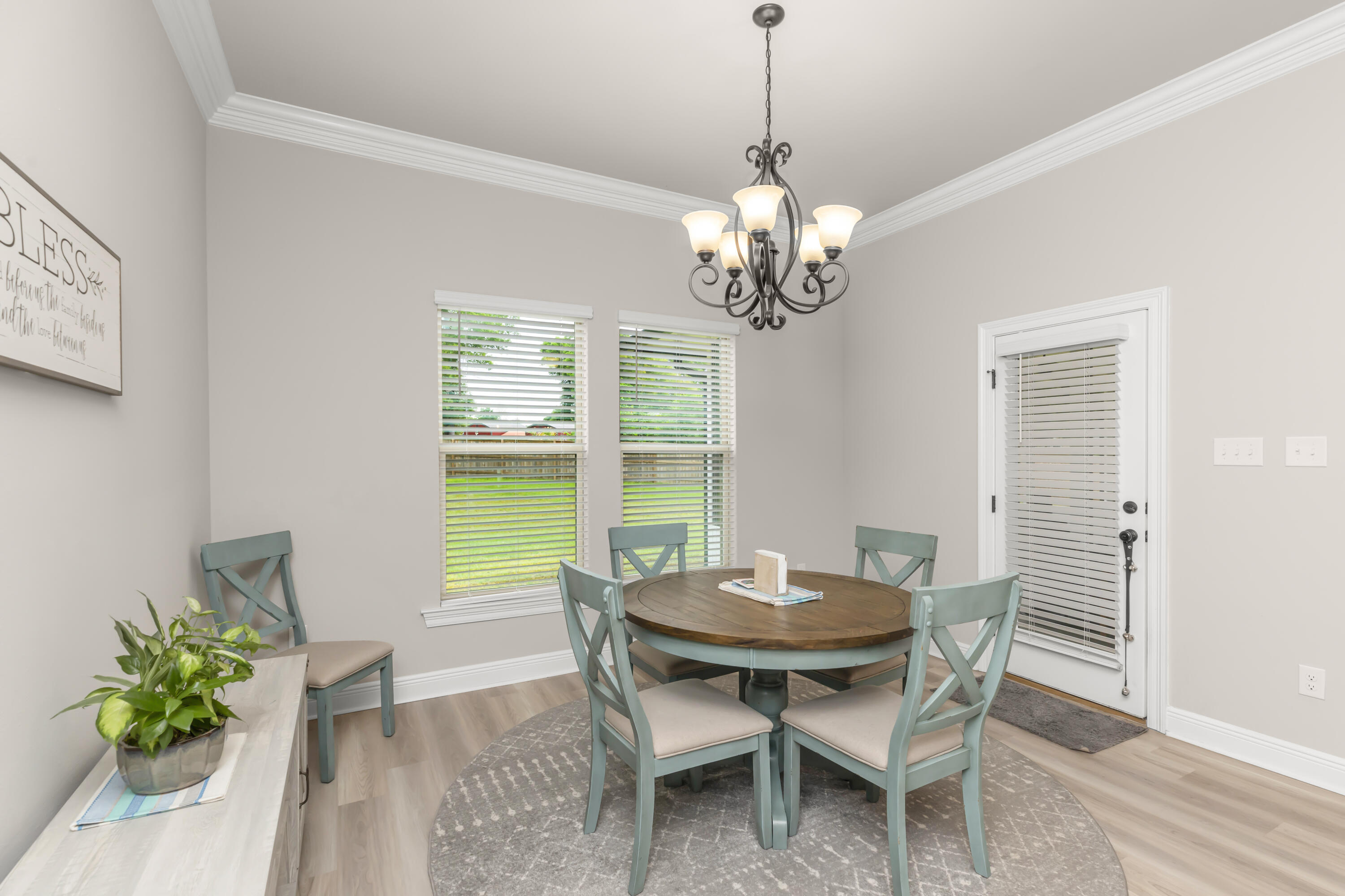 4729 Sago Palm Circle Pace, FL 32571 - Photo 11 of 29 a view of a dining room with a table and chairs