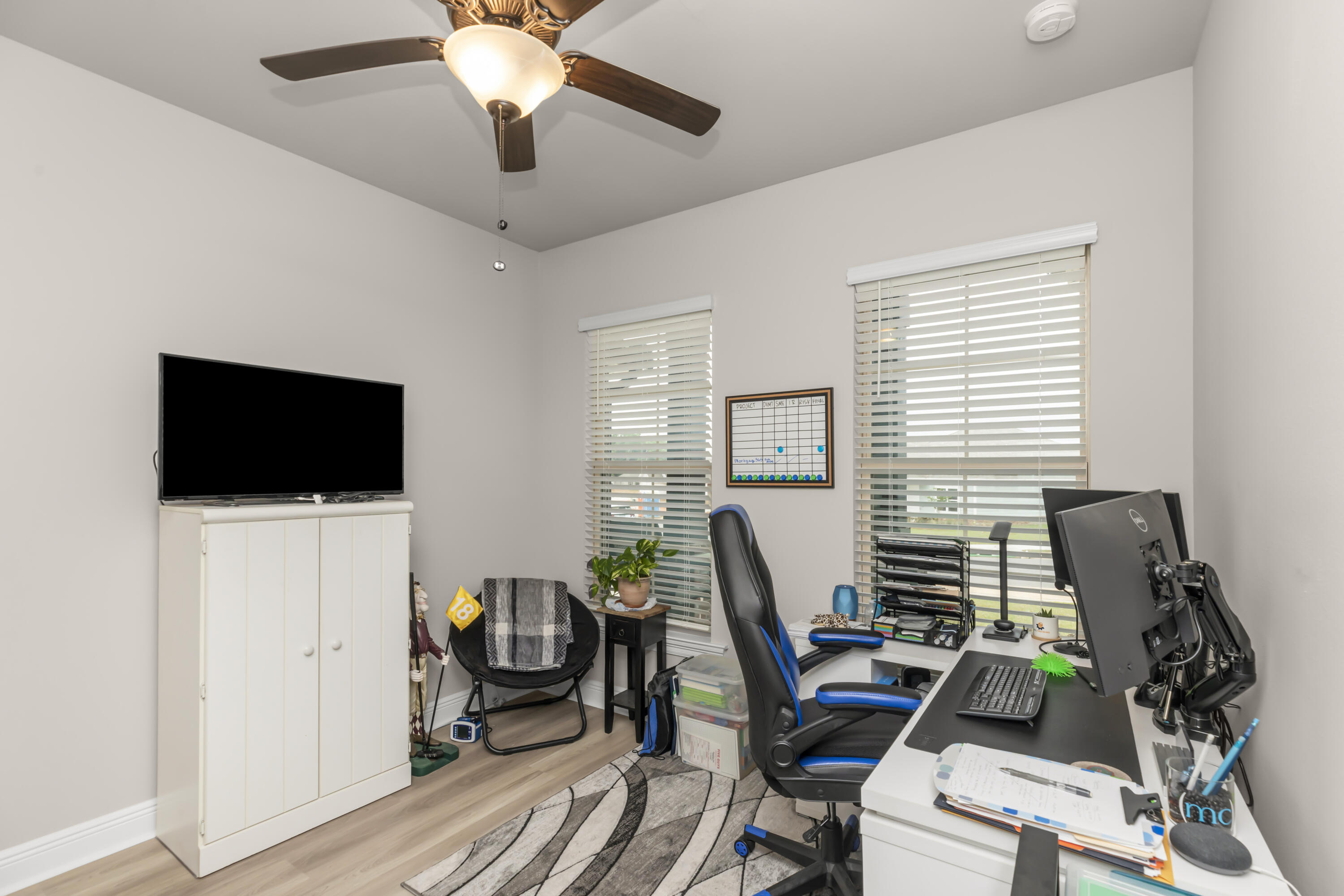 4729 Sago Palm Circle Pace, FL 32571 - Photo 13 of 29 a view of a workspace with furniture and a window