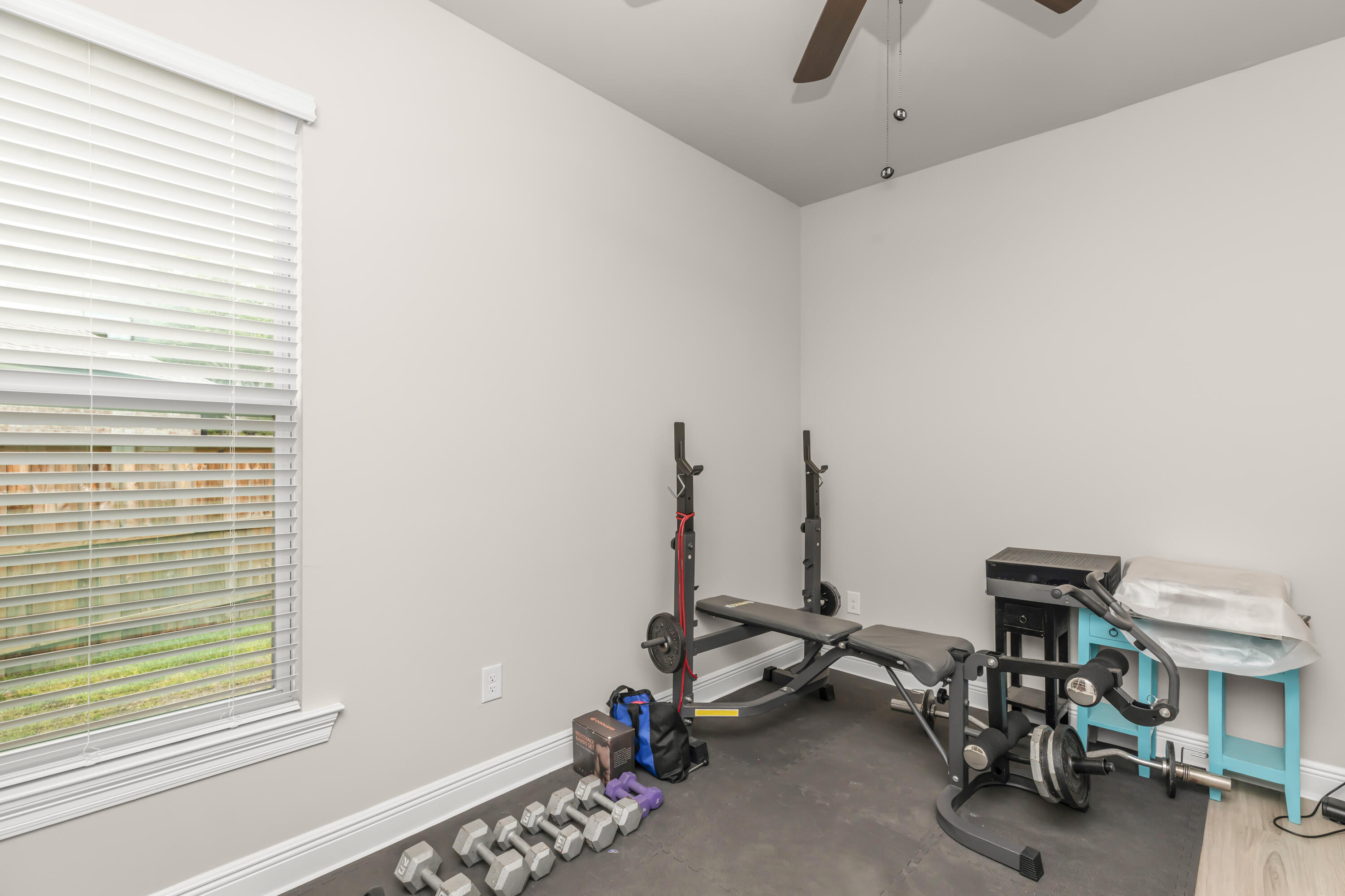 4729 Sago Palm Circle Pace, FL 32571 - Photo 14 of 29 a view of a room with gym equipment