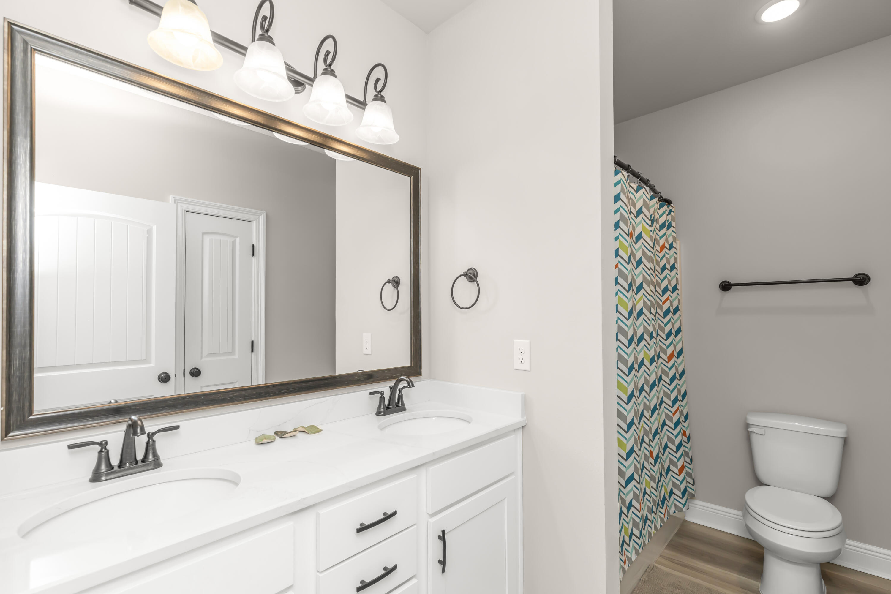 4729 Sago Palm Circle Pace, FL 32571 - Photo 16 of 29 a bathroom with a sink and a mirror