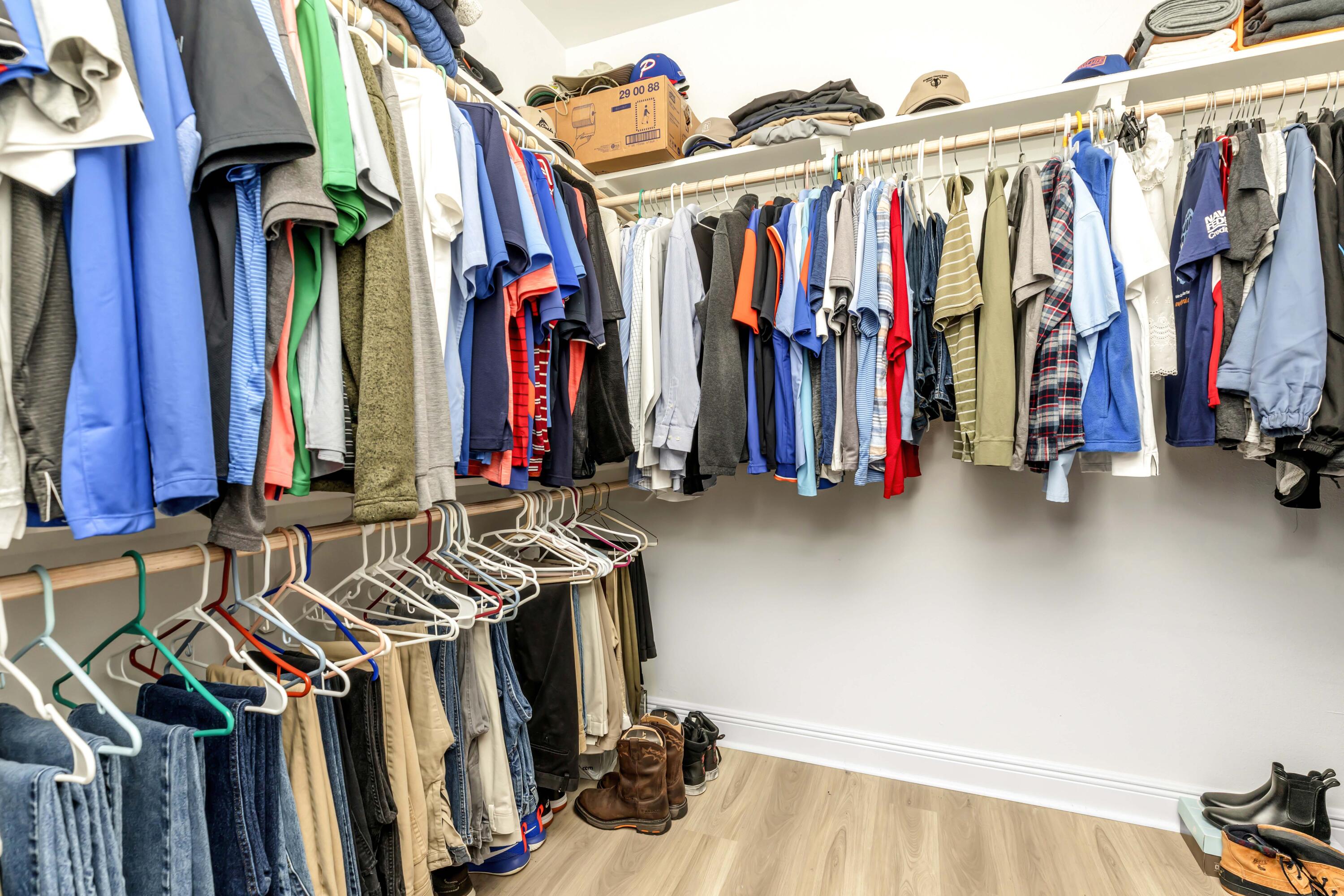 4729 Sago Palm Circle Pace, FL 32571 - Photo 23 of 29 a view of walk in closet with clothes