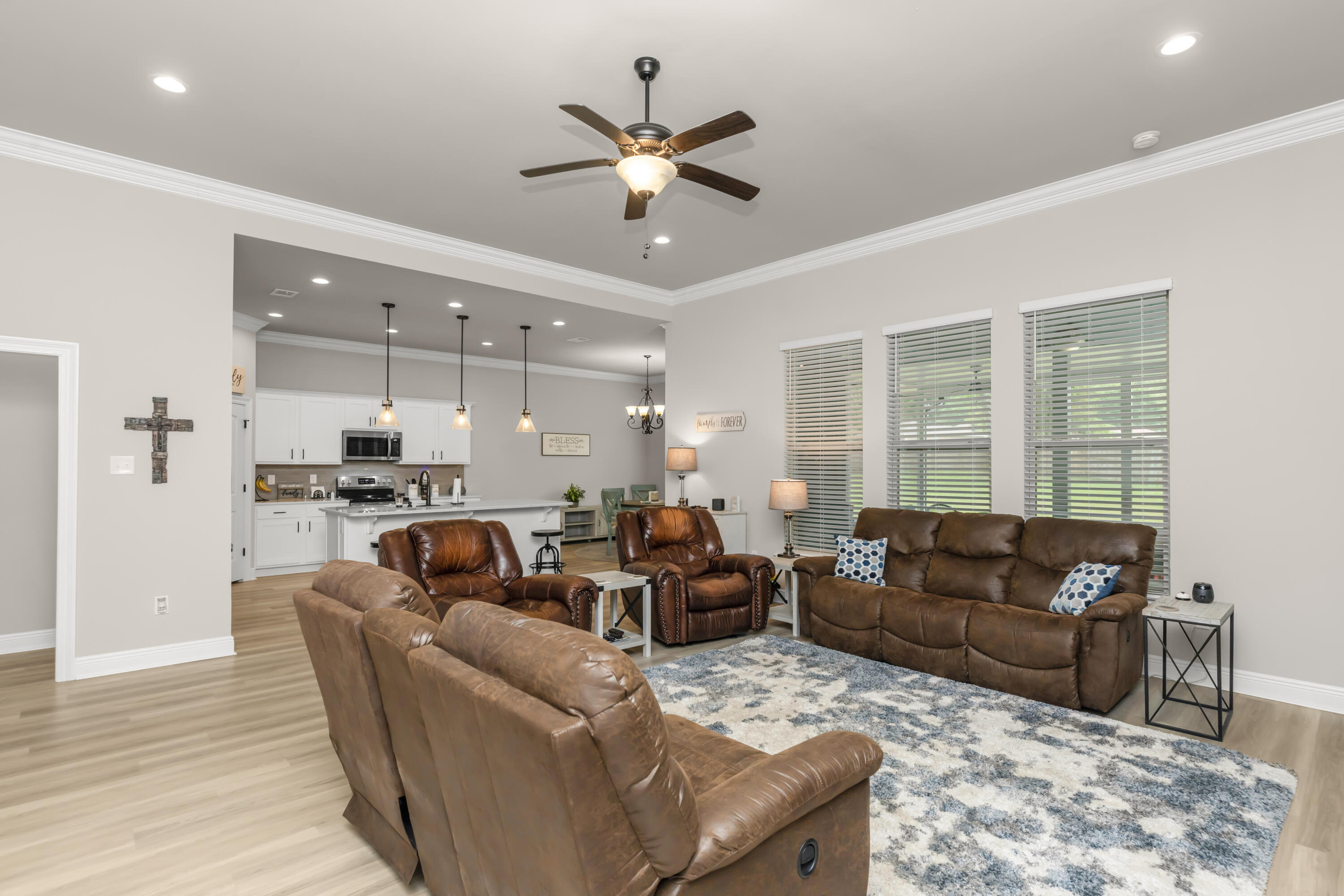 4729 Sago Palm Circle Pace, FL 32571 - Photo 5 of 29 a living room with furniture kitchen view and a large window