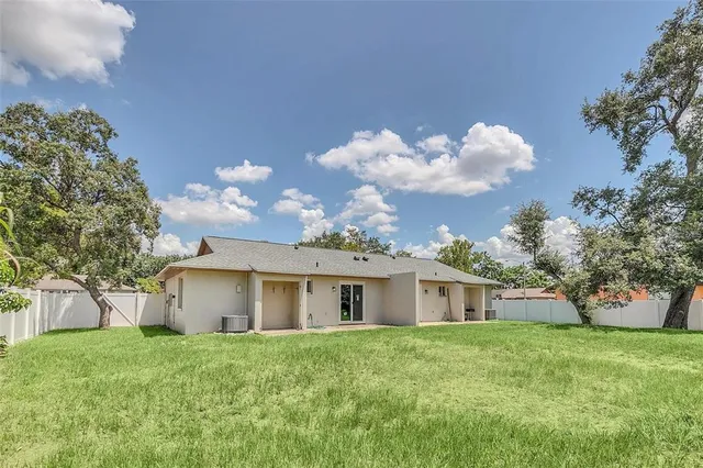 a view of a house with a back yard