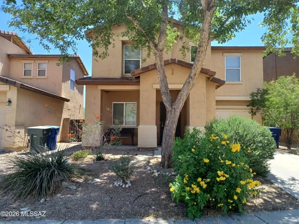 front view of a house with a small yard
