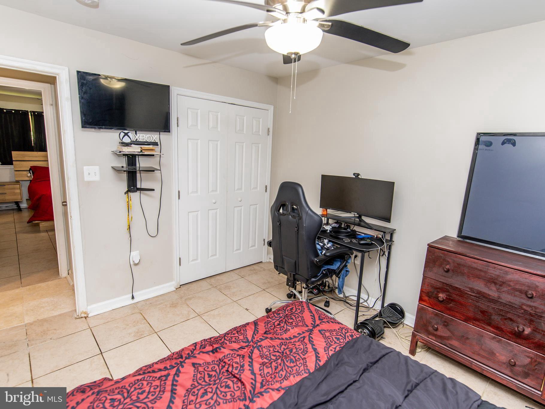 3934 Bel Pre Road, Unit 39342 Silver Spring, MD 20906 - Photo 10 of 30 a view of a workspace with furniture and a flat screen tv