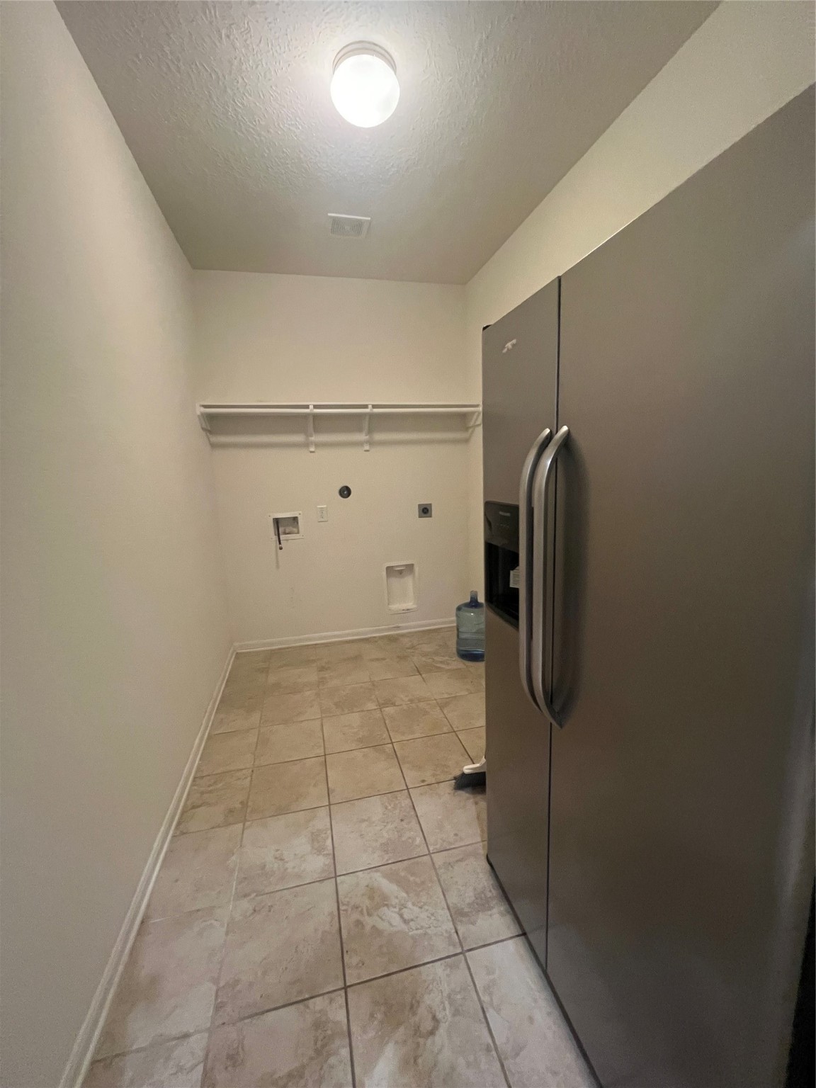 14112 Harmony Ridge Trail Pearland, TX 77584 - Photo 20 of 45 a view of a storage & utility room with washer and dryer