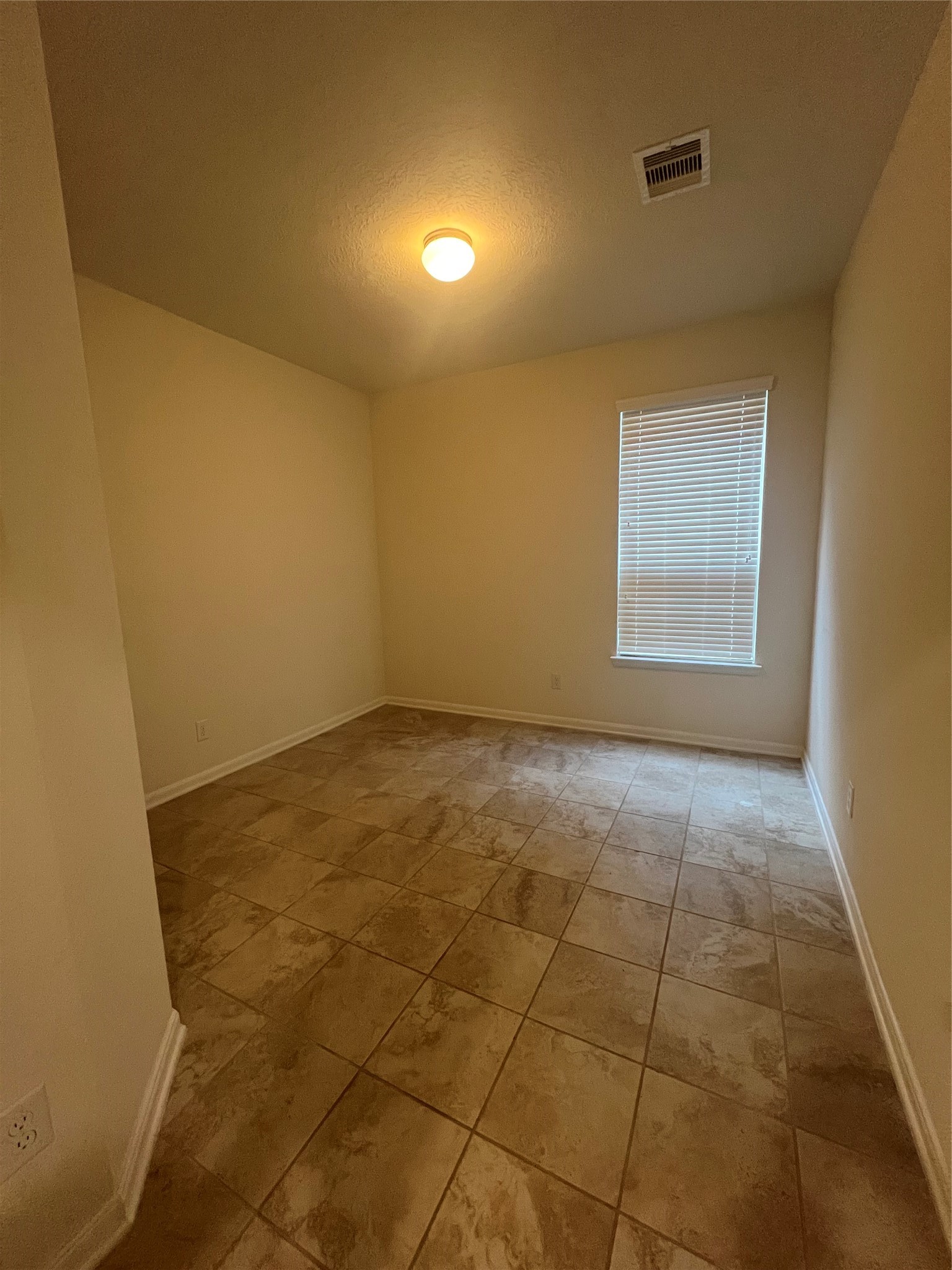 14112 Harmony Ridge Trail Pearland, TX 77584 - Photo 22 of 45 a view of an empty room with a window