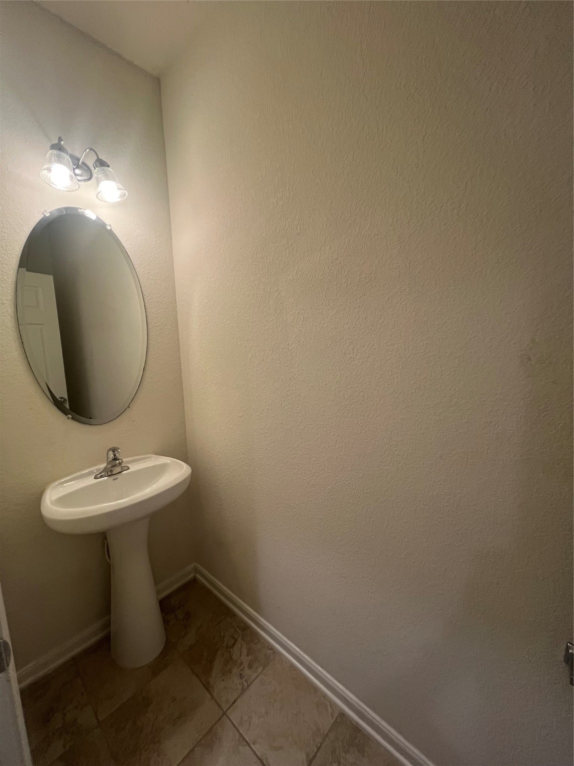 14112 Harmony Ridge Trail Pearland, TX 77584 - Photo 23 of 45 a bathroom with a sink and mirror