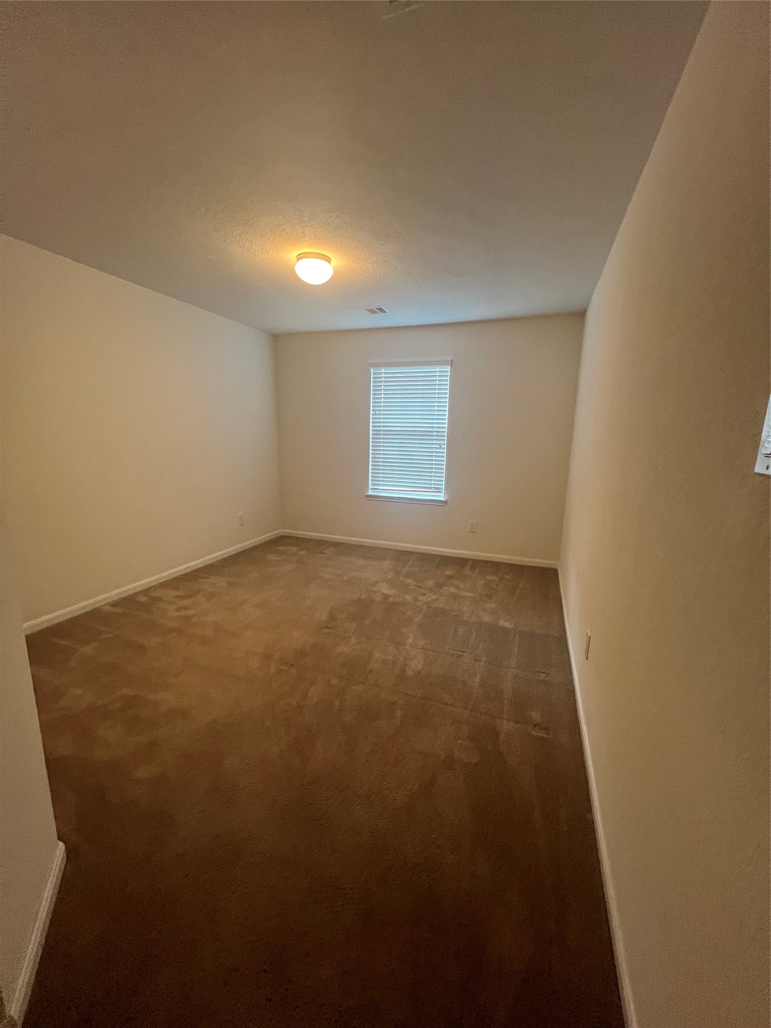 14112 Harmony Ridge Trail Pearland, TX 77584 - Photo 26 of 45 an empty room with a empty space and windows