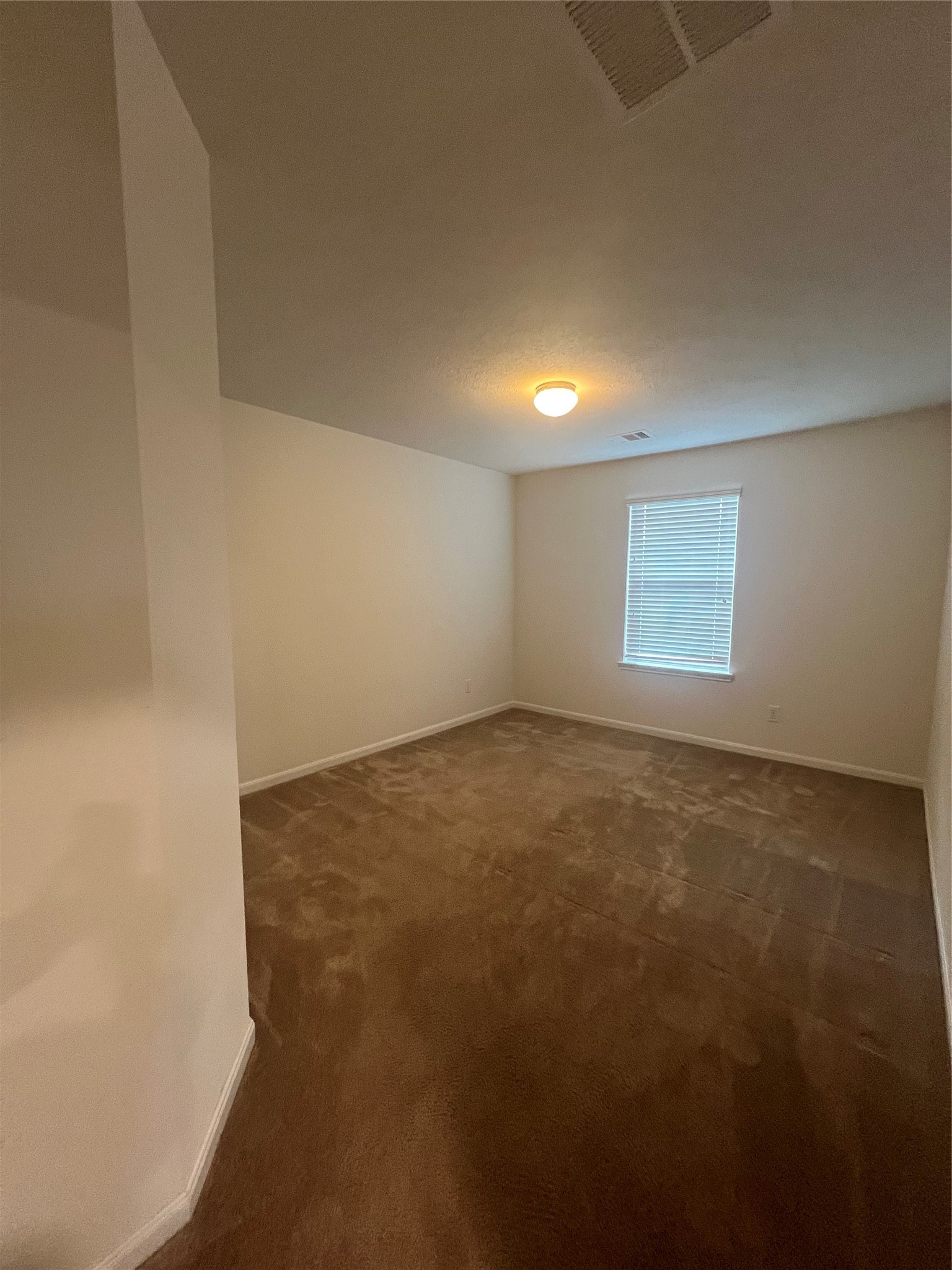14112 Harmony Ridge Trail Pearland, TX 77584 - Photo 27 of 45 an empty room with a empty space and window