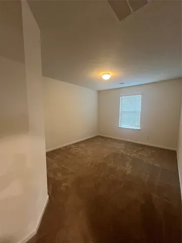 an empty room with a empty space and window