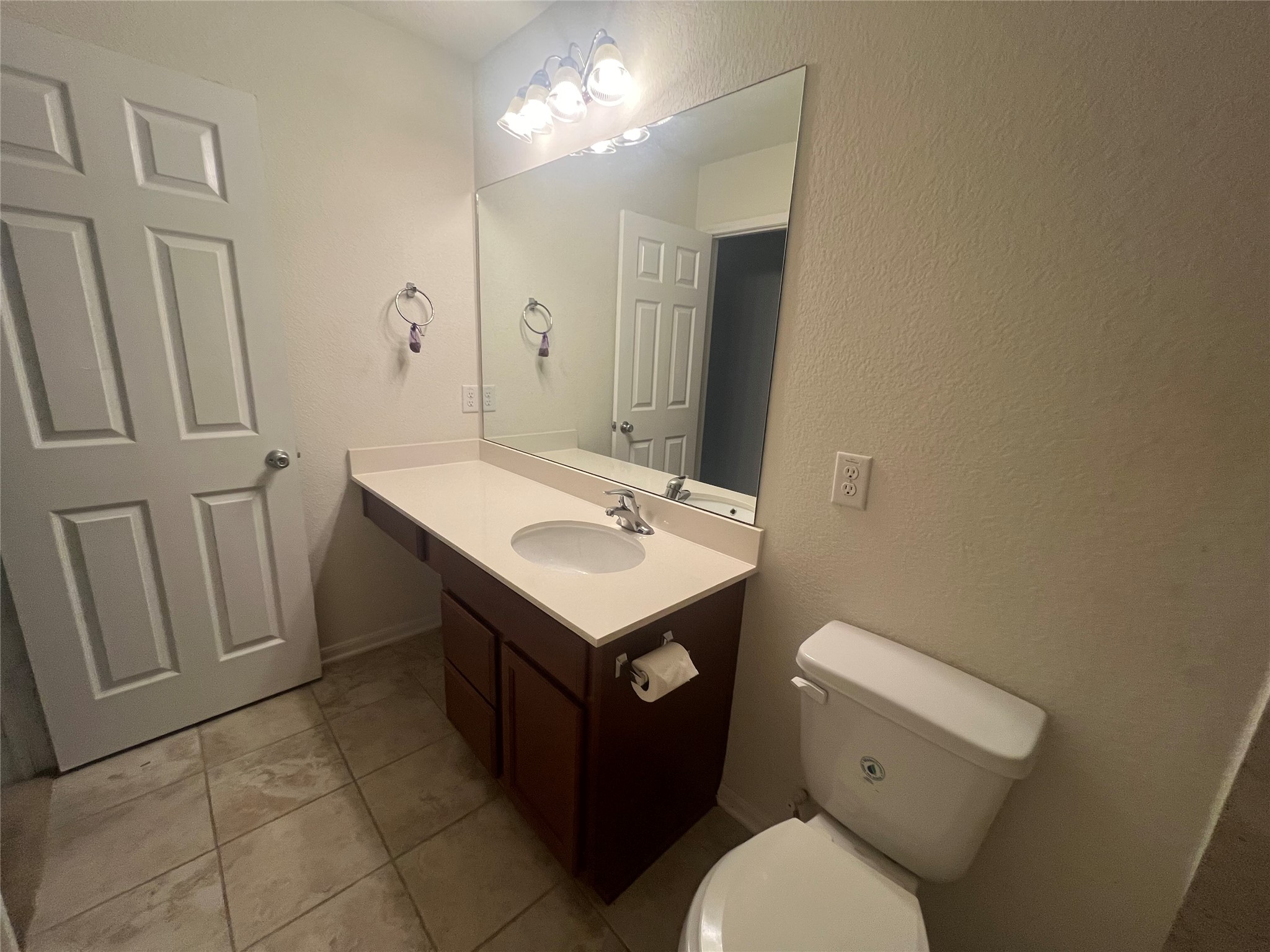 14112 Harmony Ridge Trail Pearland, TX 77584 - Photo 38 of 45 a bathroom with a sink toilet vanity and a mirror