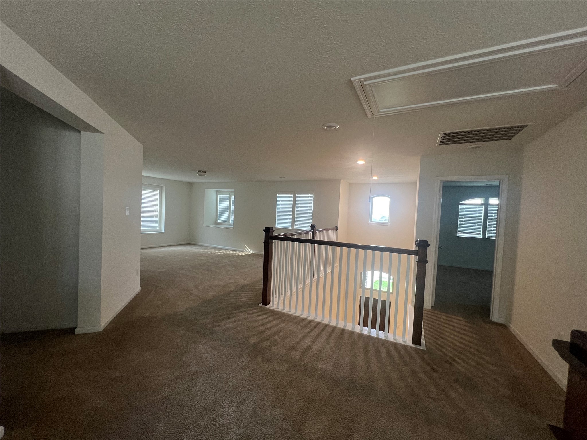 14112 Harmony Ridge Trail Pearland, TX 77584 - Photo 39 of 45 a view of a hallway with windows