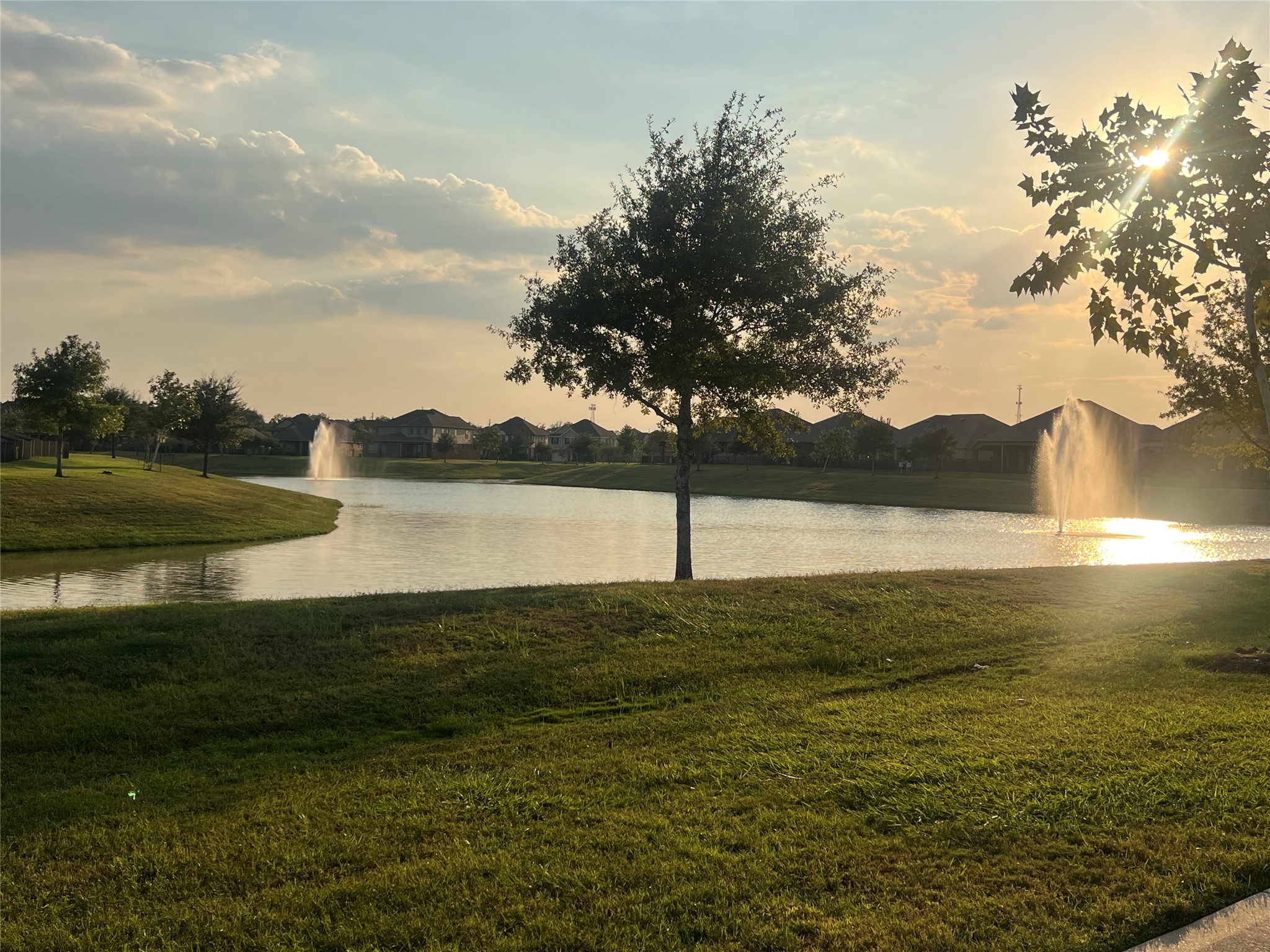 14112 Harmony Ridge Trail Pearland, TX 77584 - Photo 45 of 45 a view of a lake from a yard