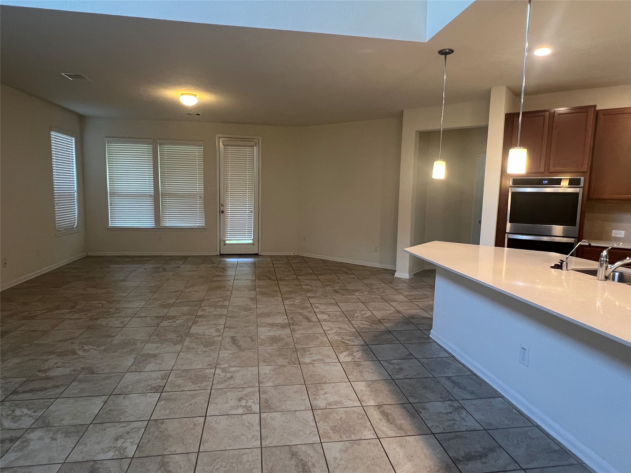 14112 Harmony Ridge Trail Pearland, TX 77584 - Photo 8 of 45 a view of a kitchen with a sink and a mirror
