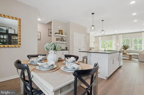 a kitchen with a table and chairs in it
