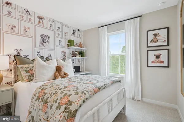 a bedroom with a bed and painting on the wall