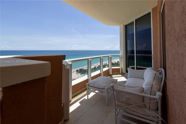 a kitchen with granite countertop a stove top oven a sink dishwasher and cabinets with wooden floor