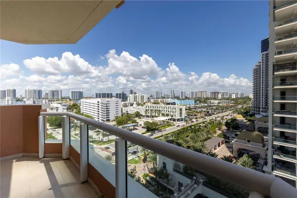 a view of closet with wooden floor