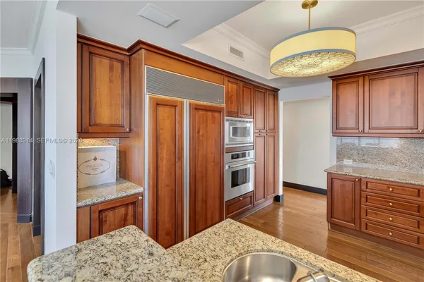 a room with furniture and a wooden floor