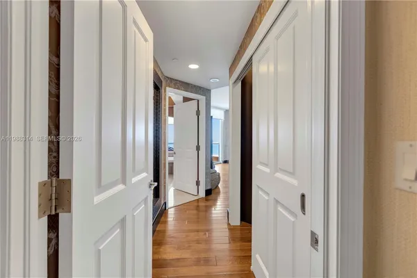 a lobby with furniture and a flat screen tv