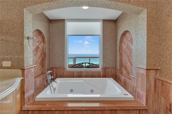 a hallway with furniture and wooden floor