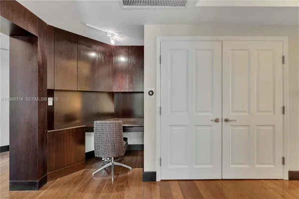 a bathroom with a shower curtain and a window